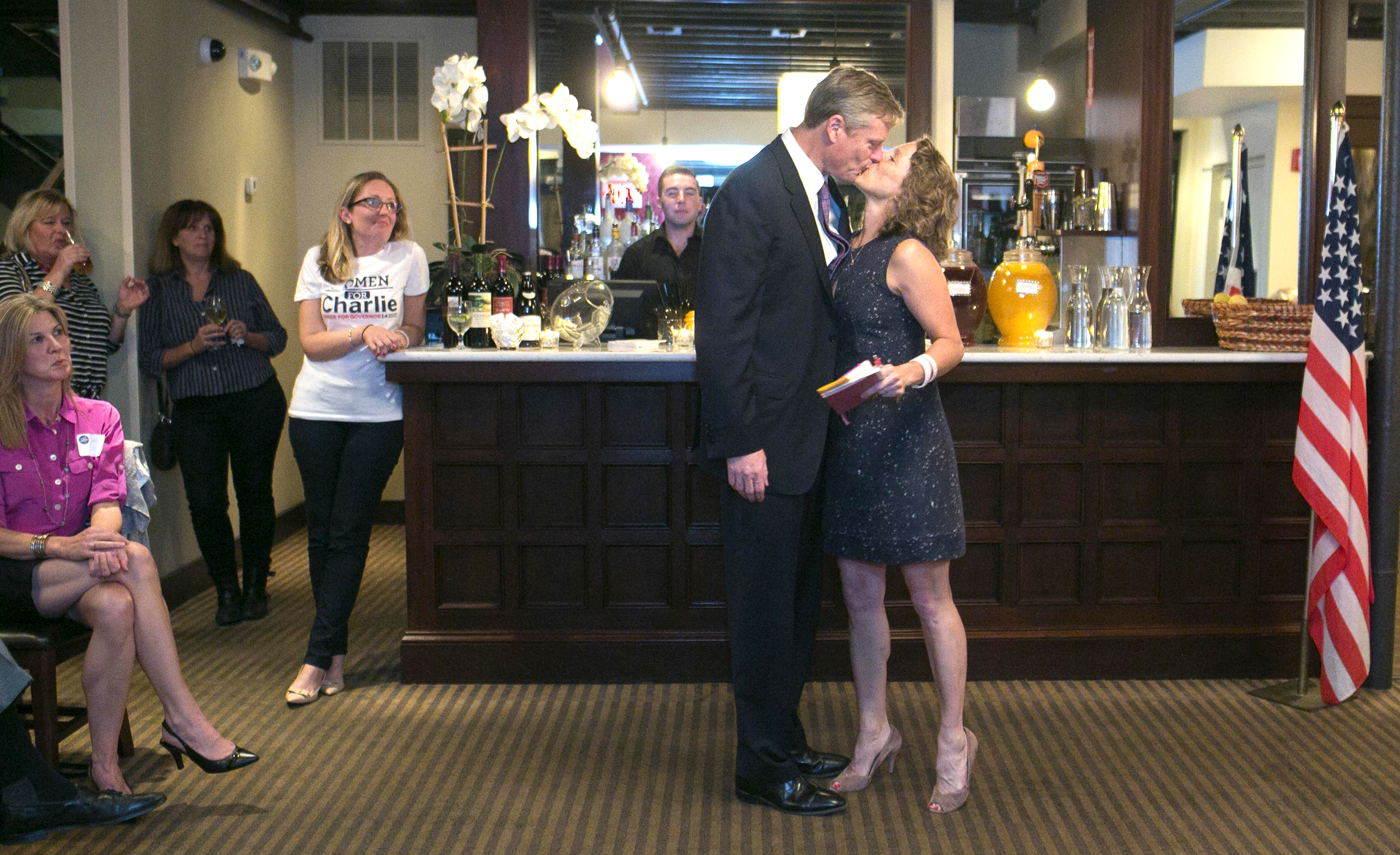 GOP gubernatorial hopeful Charlie Baker kissed his wife, Lauren, when he made an appearance at an event she held in West Roxbury.