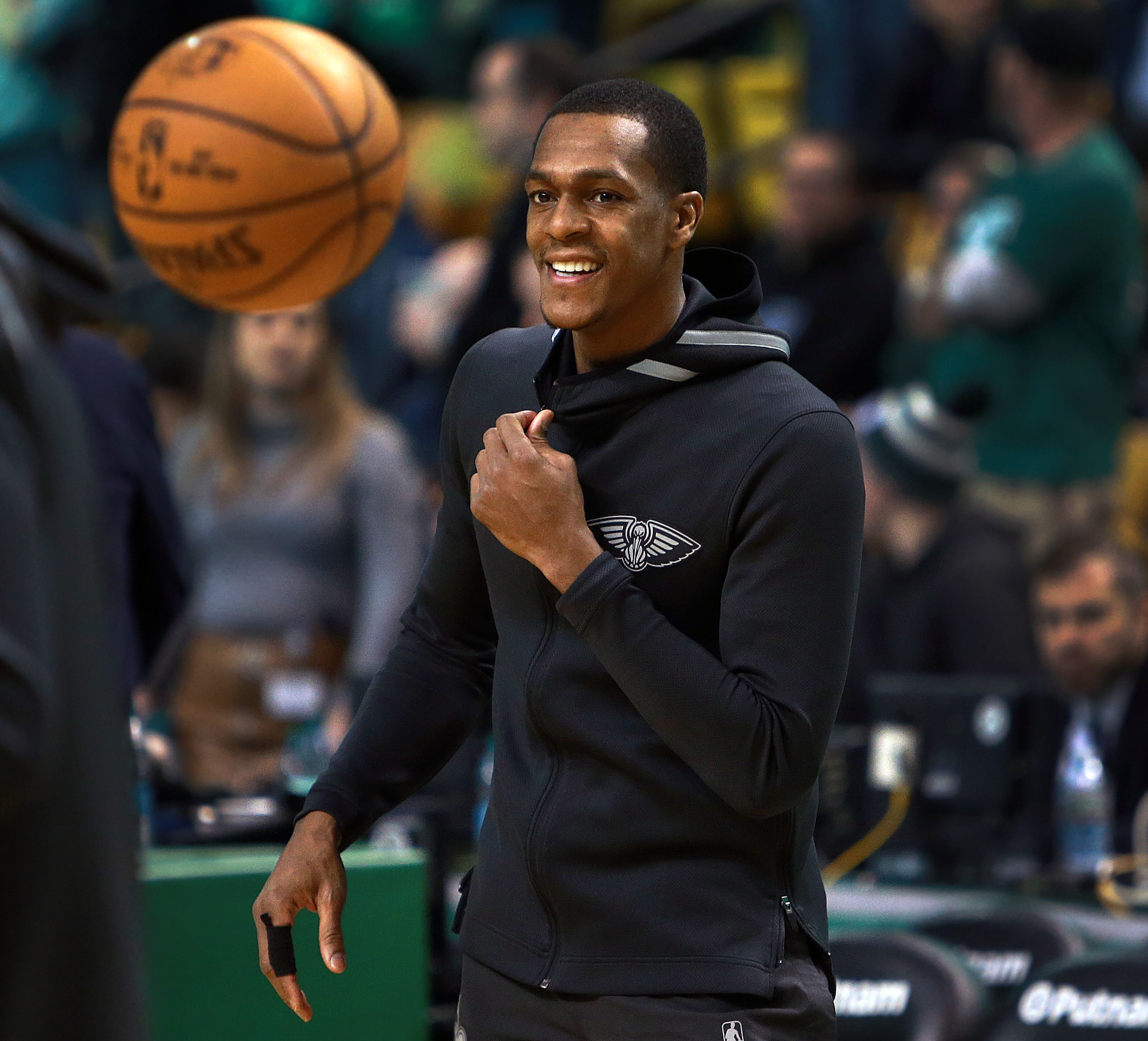 Rajon Rondo, 31, flashes a smile during warmups Tuesday at TD Garden.