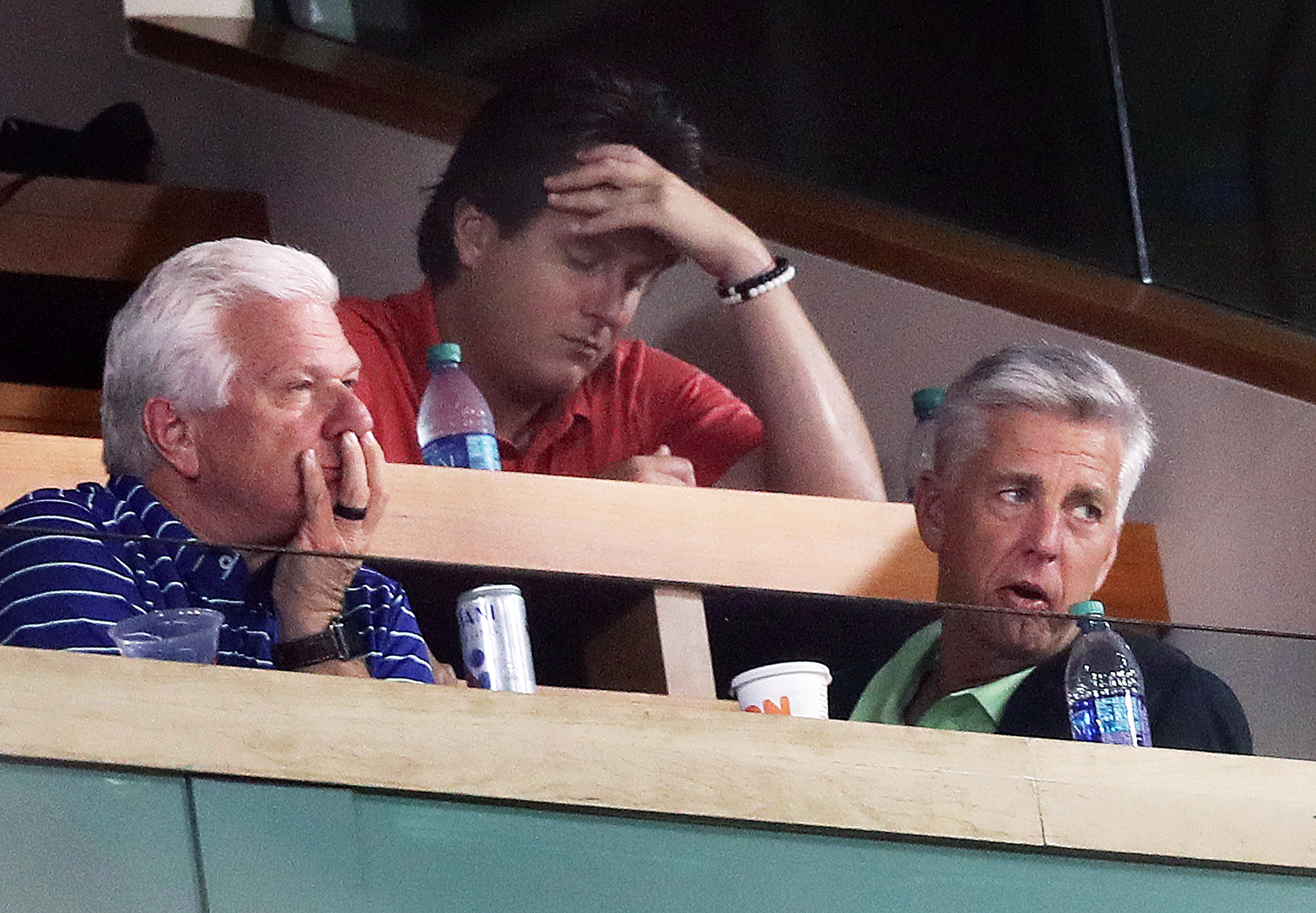With the trade deadline hours away, Red Sox president of baseball operations Dave Dombrowski (bottom right) doesn't look too happy after the Rays took the lead in the sixth inning Tuesday. Senior vice president of baseball operations Frank Wren is at lower left.