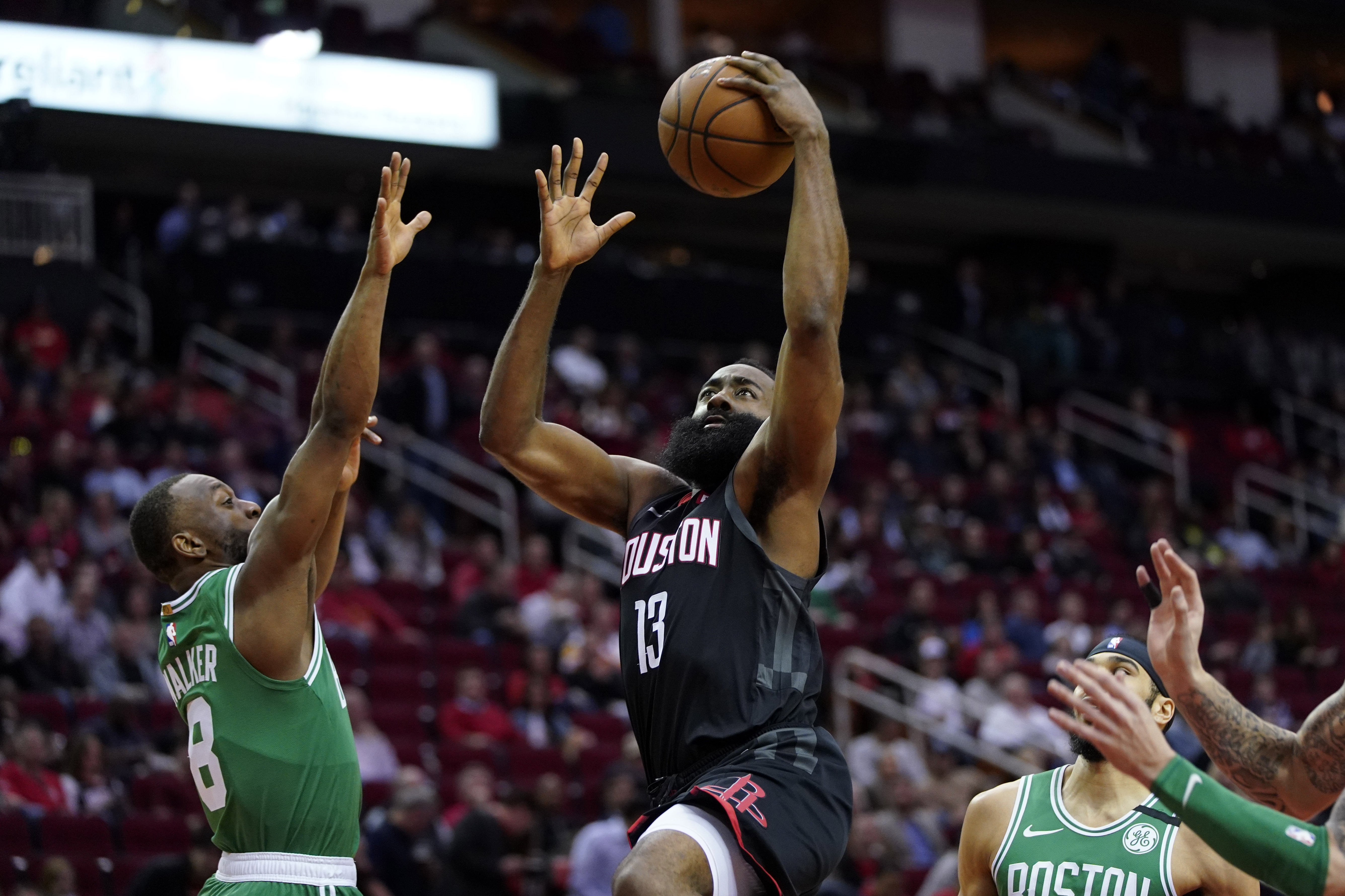 Houston’s James Harden goes up for a shot as Kemba Walker looks to defend in the first half of Tuesday’s game.