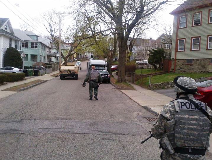 Cape Ann Regional Response Team members Sgt. Paul Francis in foreground and Lt. Mark Schmink clearing a neighborhood in Watertown.