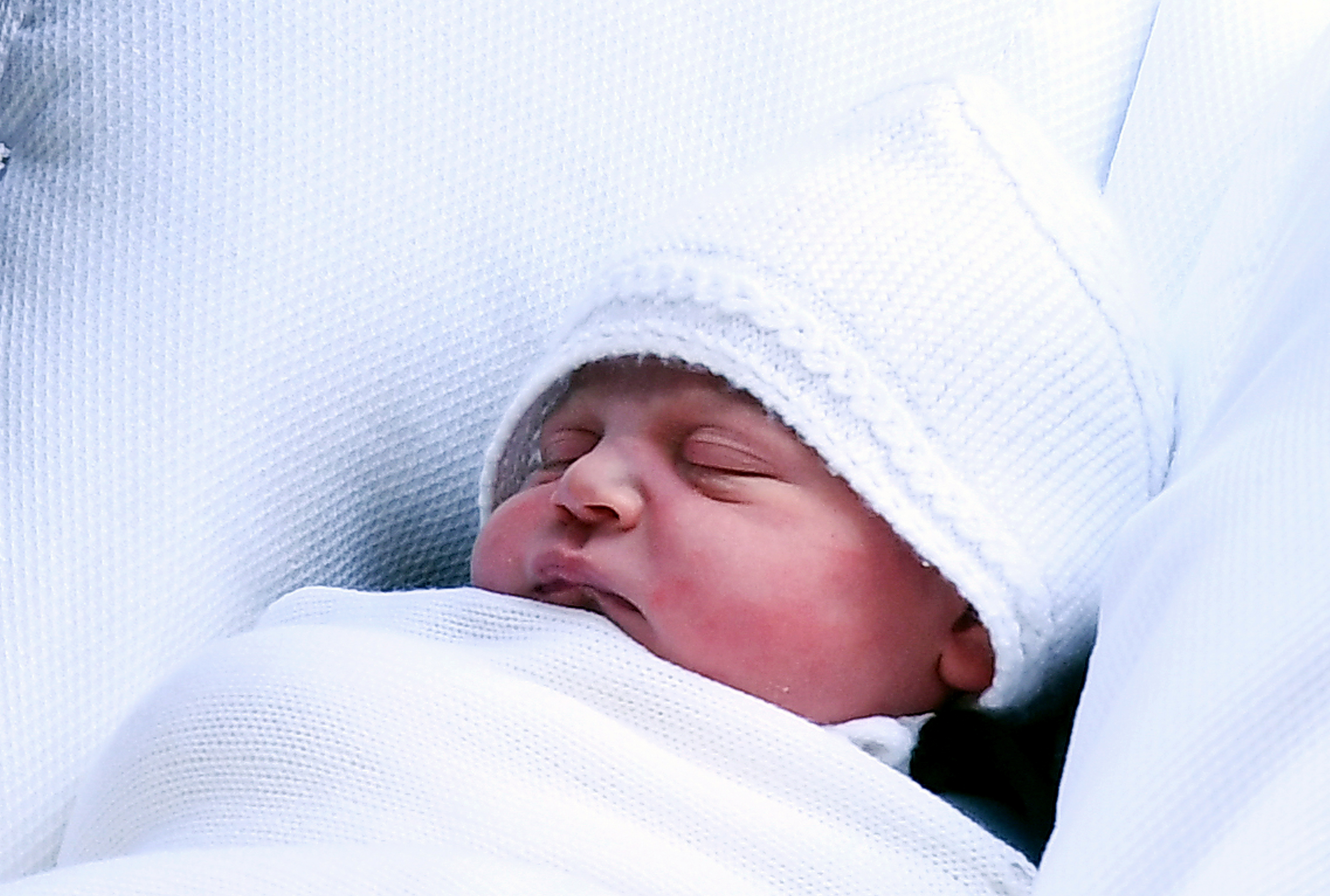 Britain's Prince William, Duke of Cambridge, carries his newborn son as they leave the Lindo Wing at St. Mary's Hospital in Paddington, London, Britain, 23 April 2018. The baby boy is the royal couple's third child and fifth in line to the British throne.