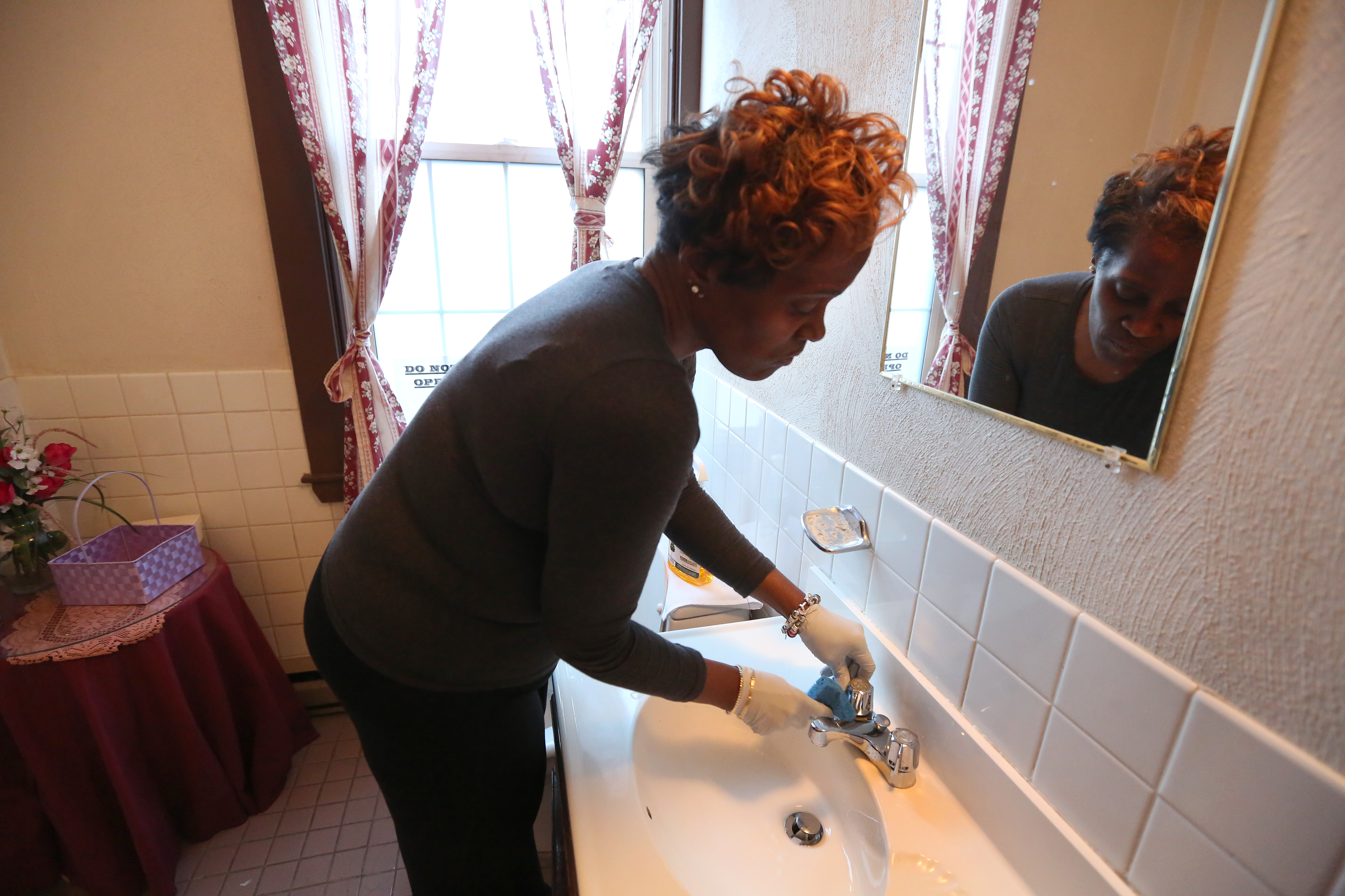 The Rev. Laura Ahart cleans the United Baptist Church herself.