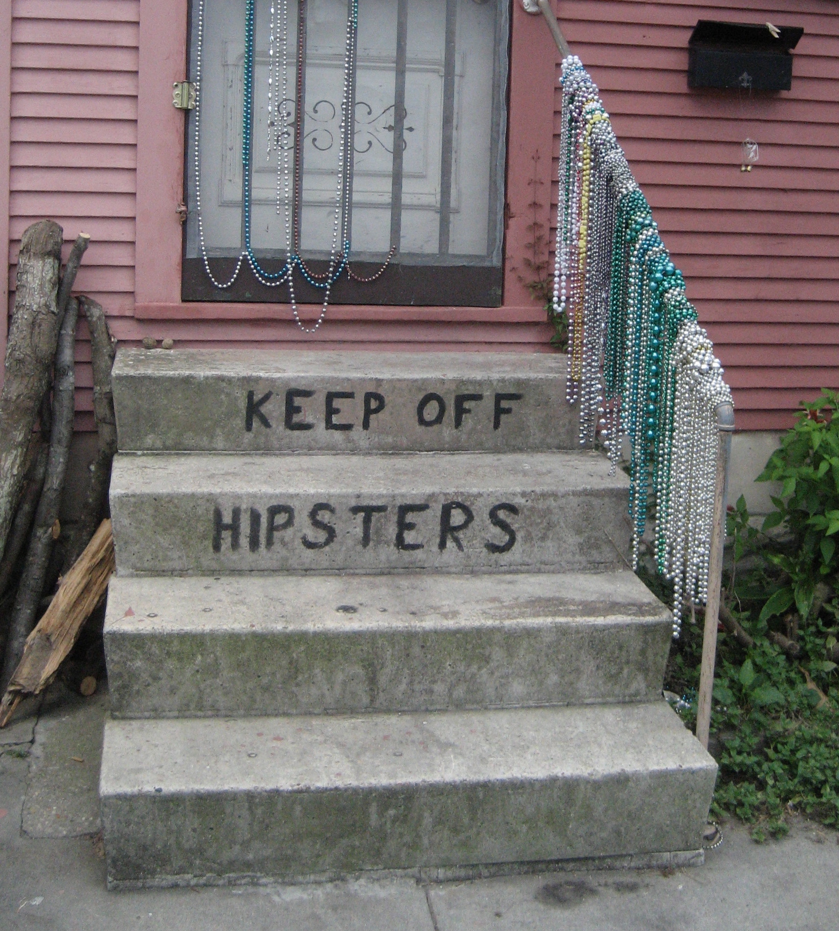 A hand-painted warning on the steps of a home in the Bywater section of New Orleans is allegedly intended for patrons of a nearby bar.