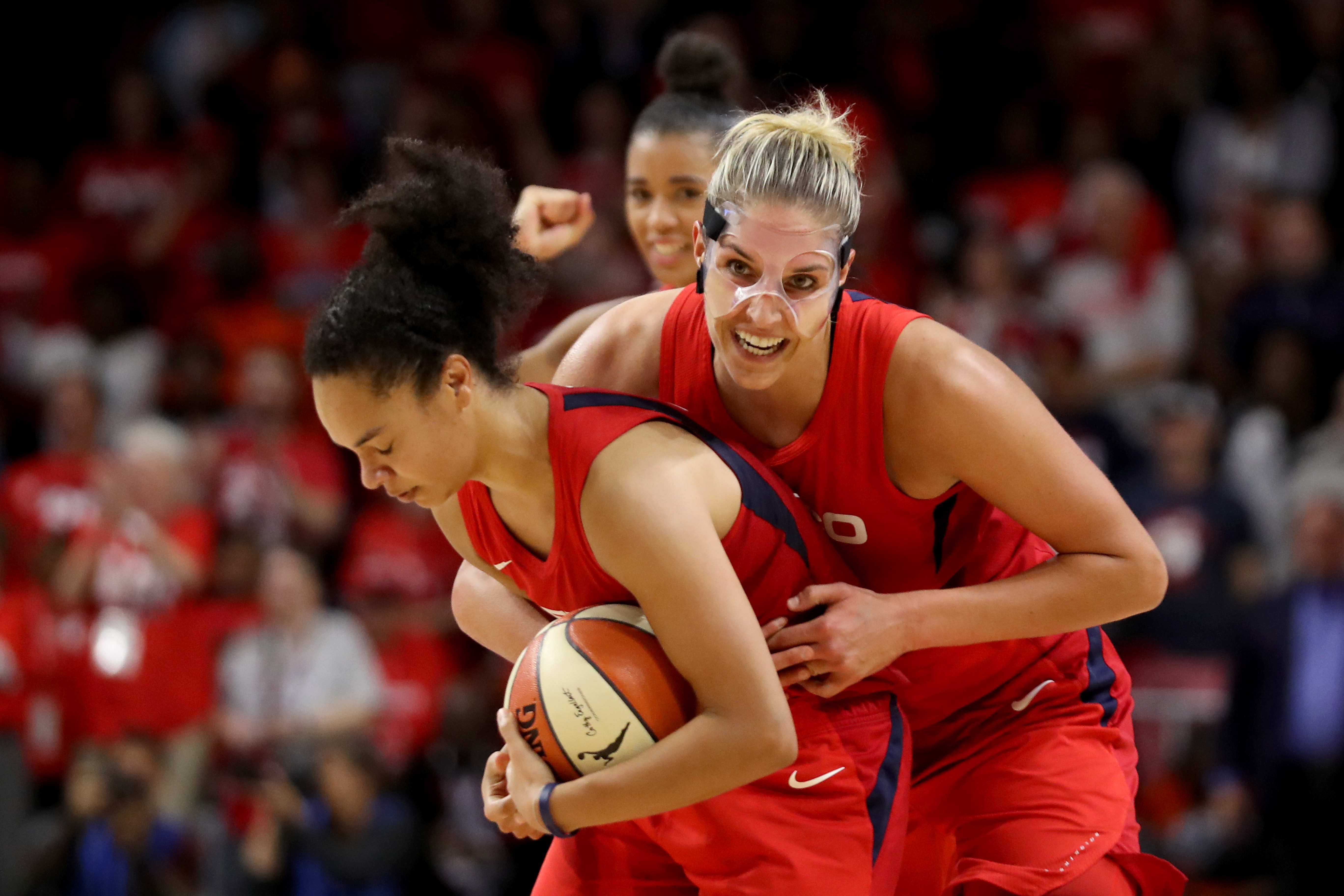 The Washington Mystics’ Elena Delle Donne, right, celebrated with teammate Kristi Toliver after defeating the Connecticut Sun for the WNBA title.