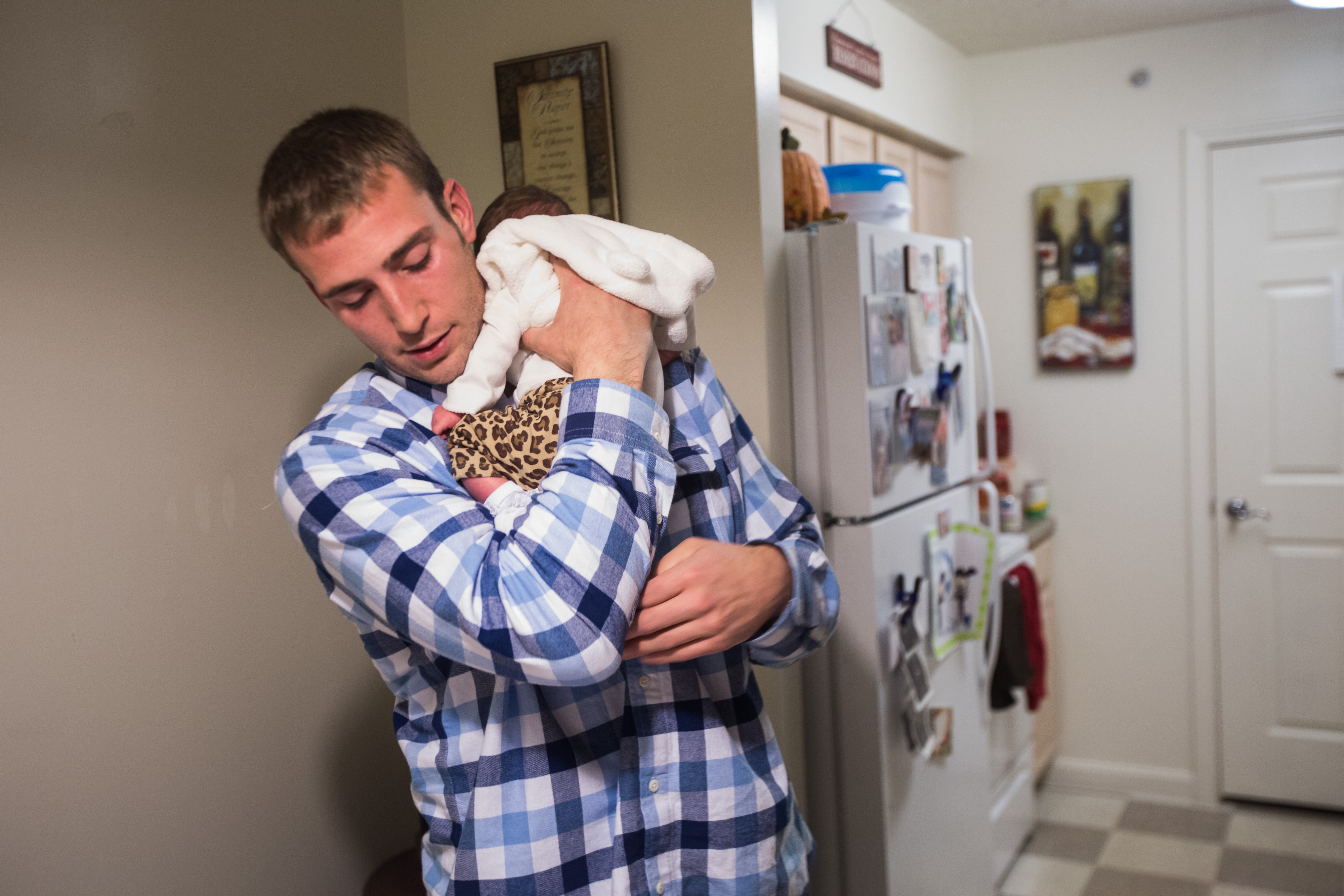 Ryan Lonergan held his newborn daughter, Ashtyn, at home.
