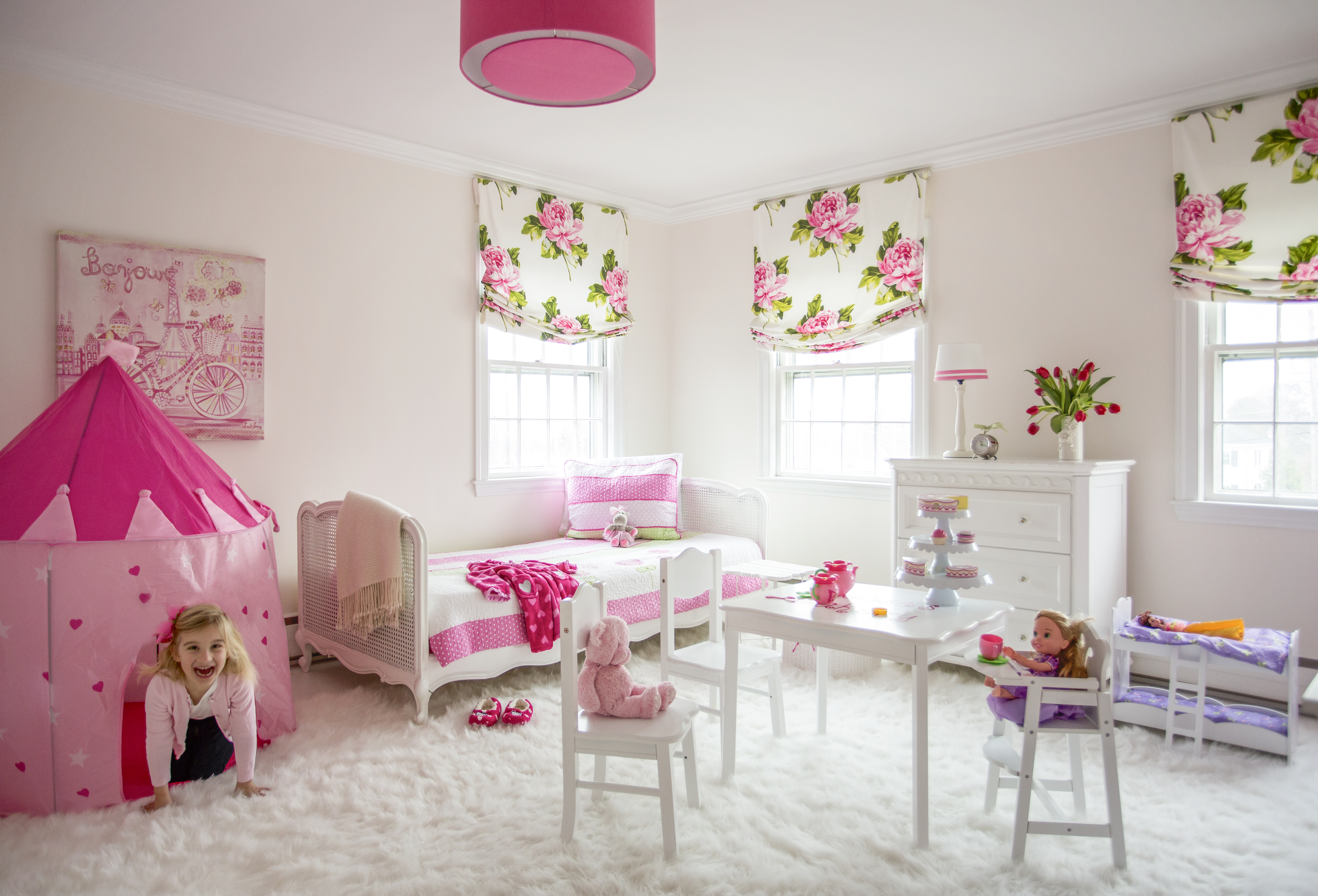 The walls in the girl’s room are lightly tinted pink to complement the rest of the decor.