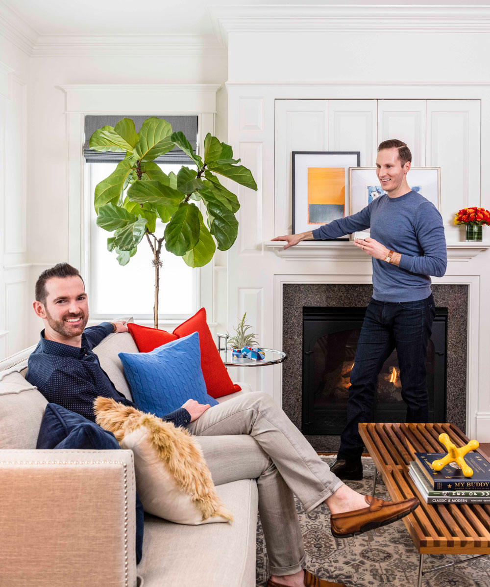 Jim Mattus (left) and Trevor Fulmer relax in their South Boston living room.