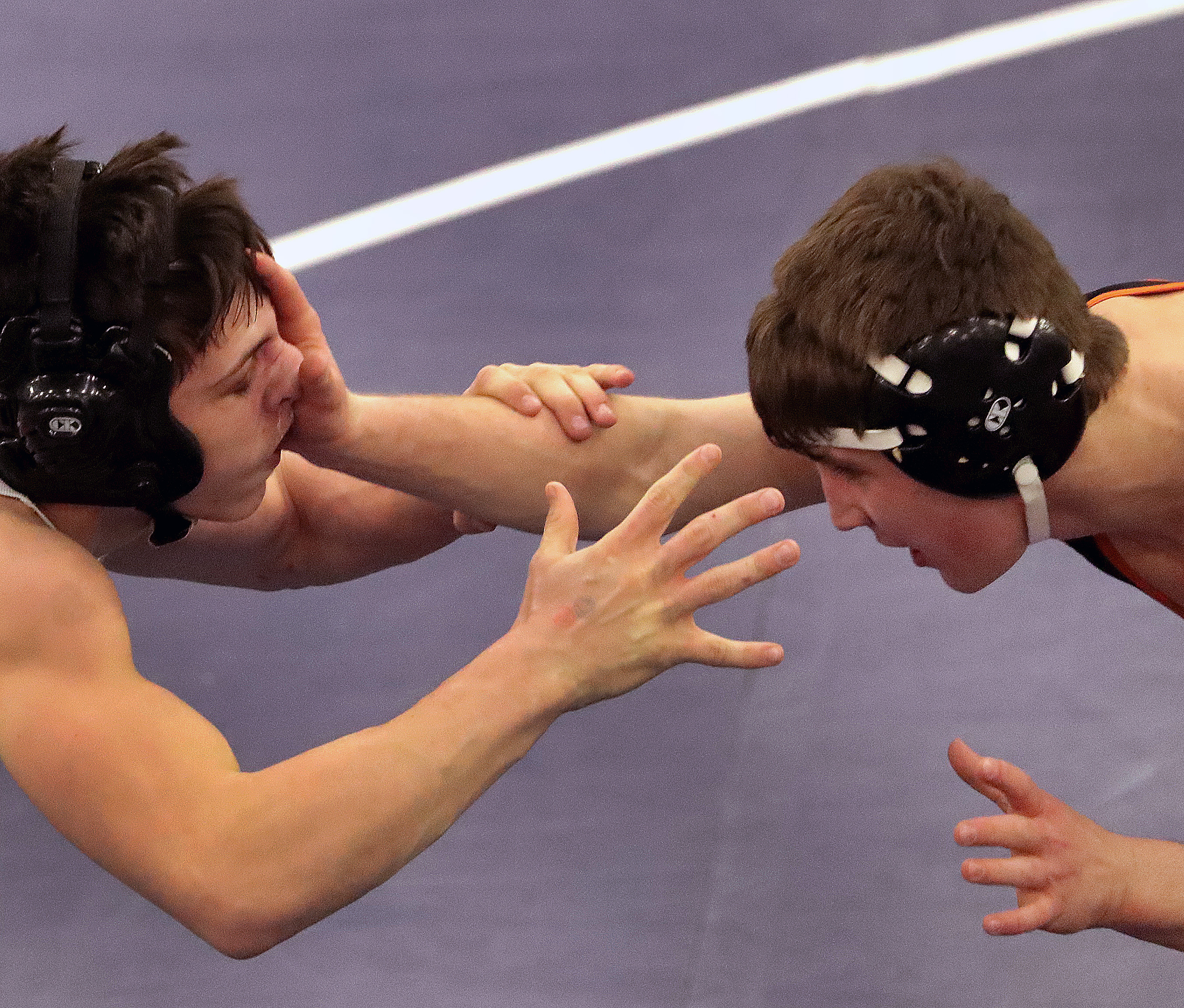 Ryan Garlitz (left) and Ramazan Attasauov in the 132-pound final at the All-State wrestling championships.