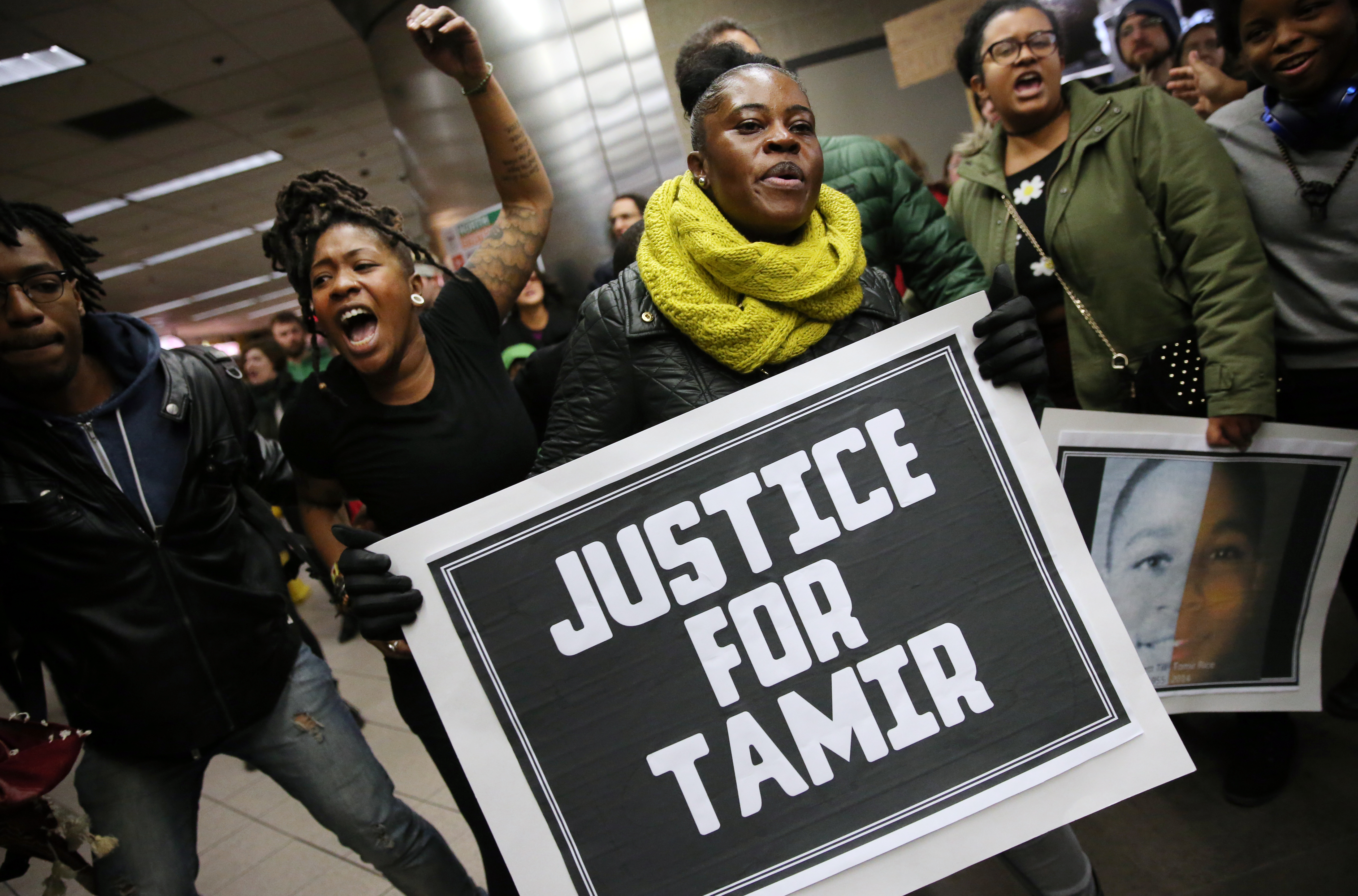 Boston, MA 01/02/2016 Ð Lanise Frazier (cq) , second from left, and Carline Perry (cq) chant during the Black Lives Matter rally at the TD Garden in Boston, MA, on January 02, 2015. Protesters started at the Part Street Station then took train to North Station where they protested at the entrance to the Garden. (Globe staff photo / Craig F. Walker) section: Metro reporter: Allen