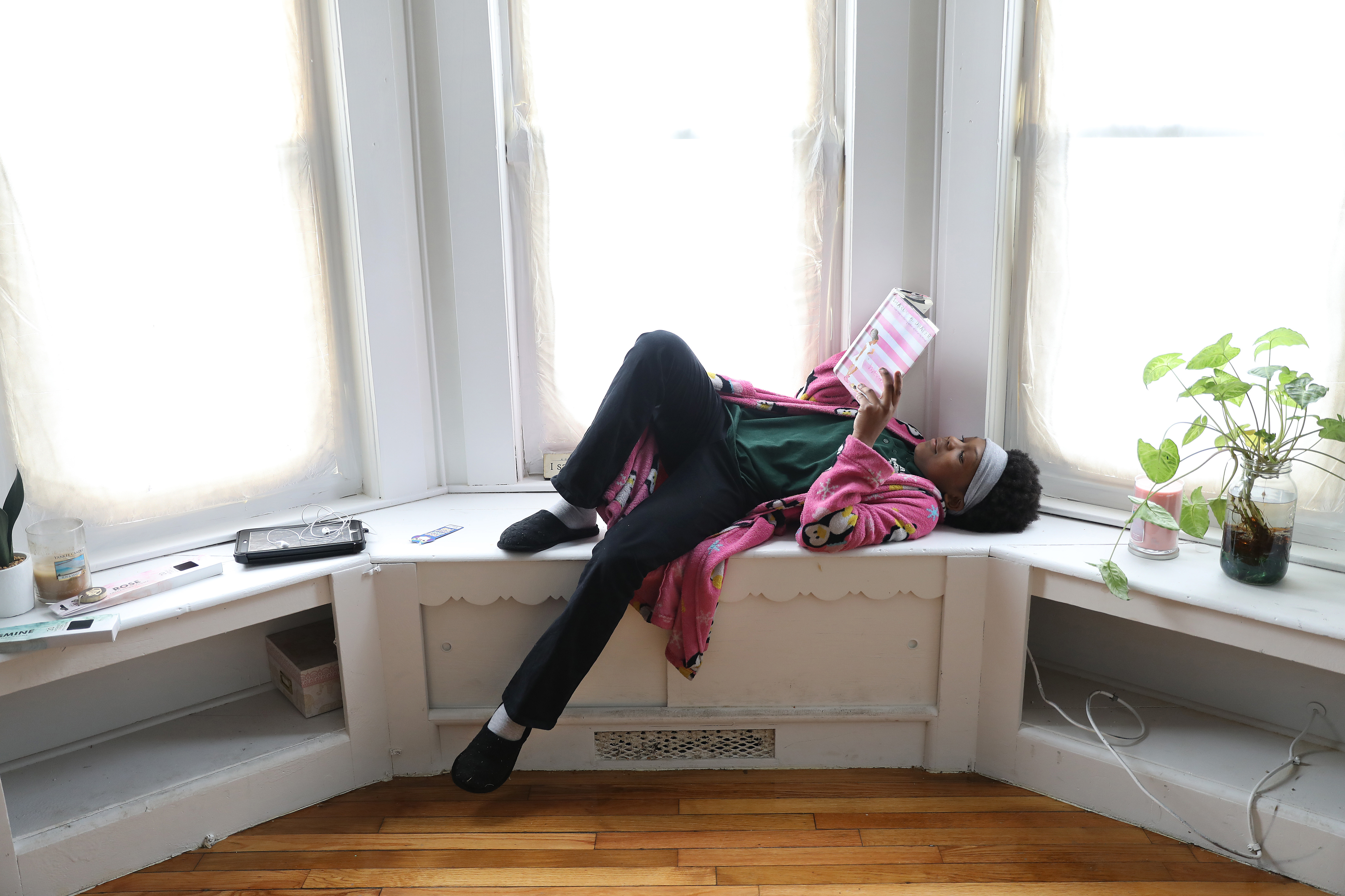 Ryah reading at home in Dorchester.