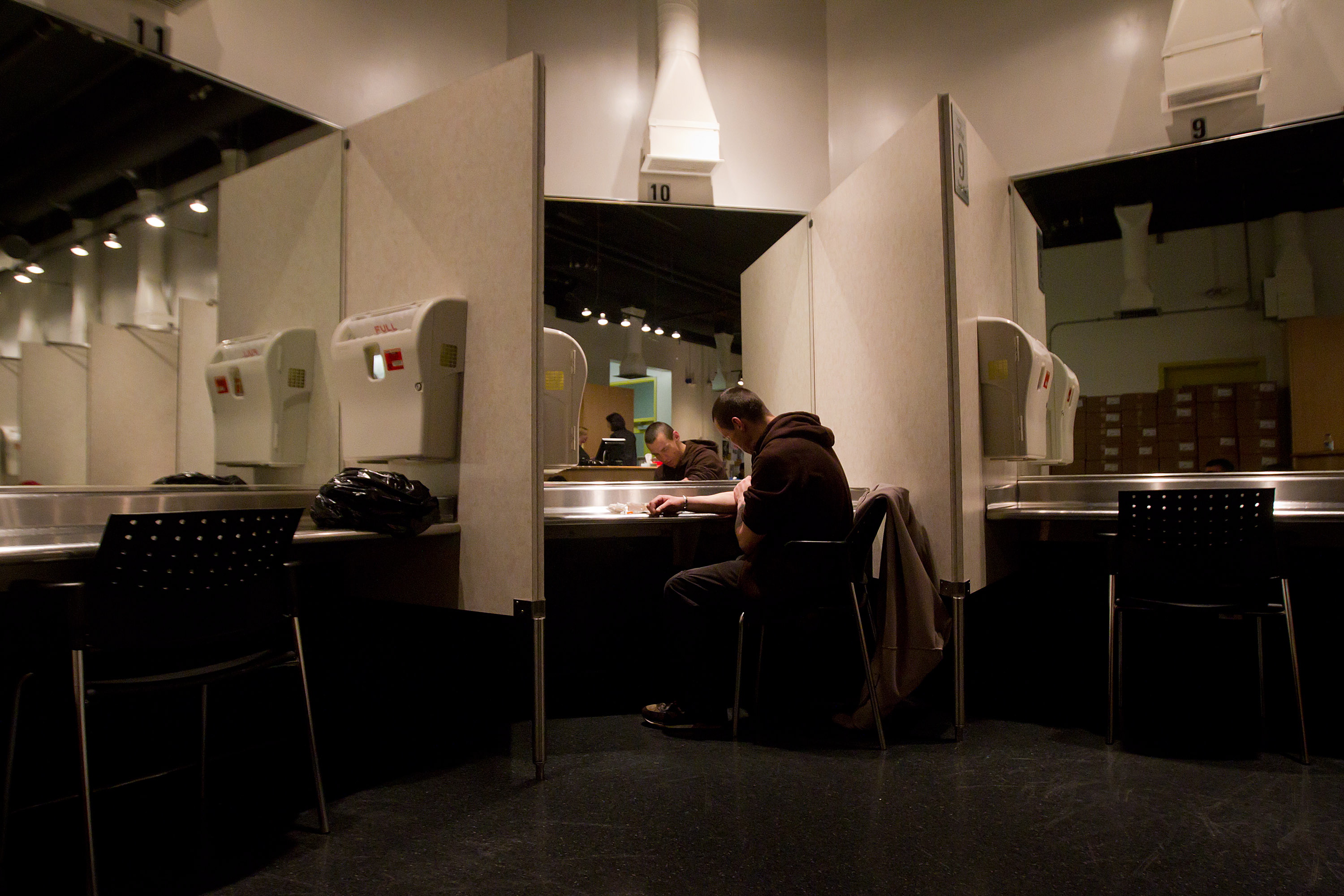 A man rested after injecting heroin he bought on the street at the Insite safe injection clinic in Vancouver, B.C. in 2011.
