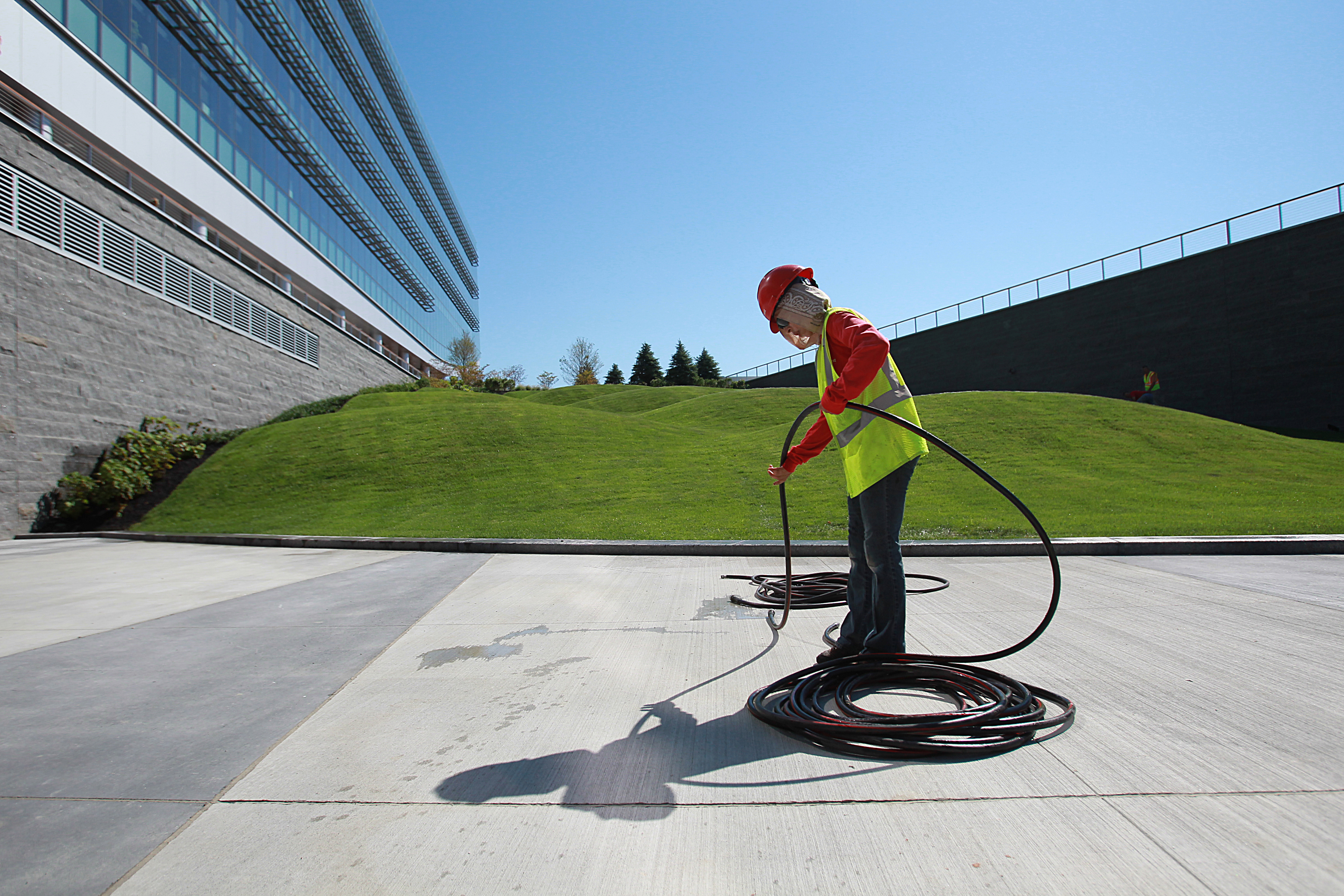 Part of the lawn outside the New Balance building was desiged with undulations, or moguls, for employees to lean back on as they converse outside.