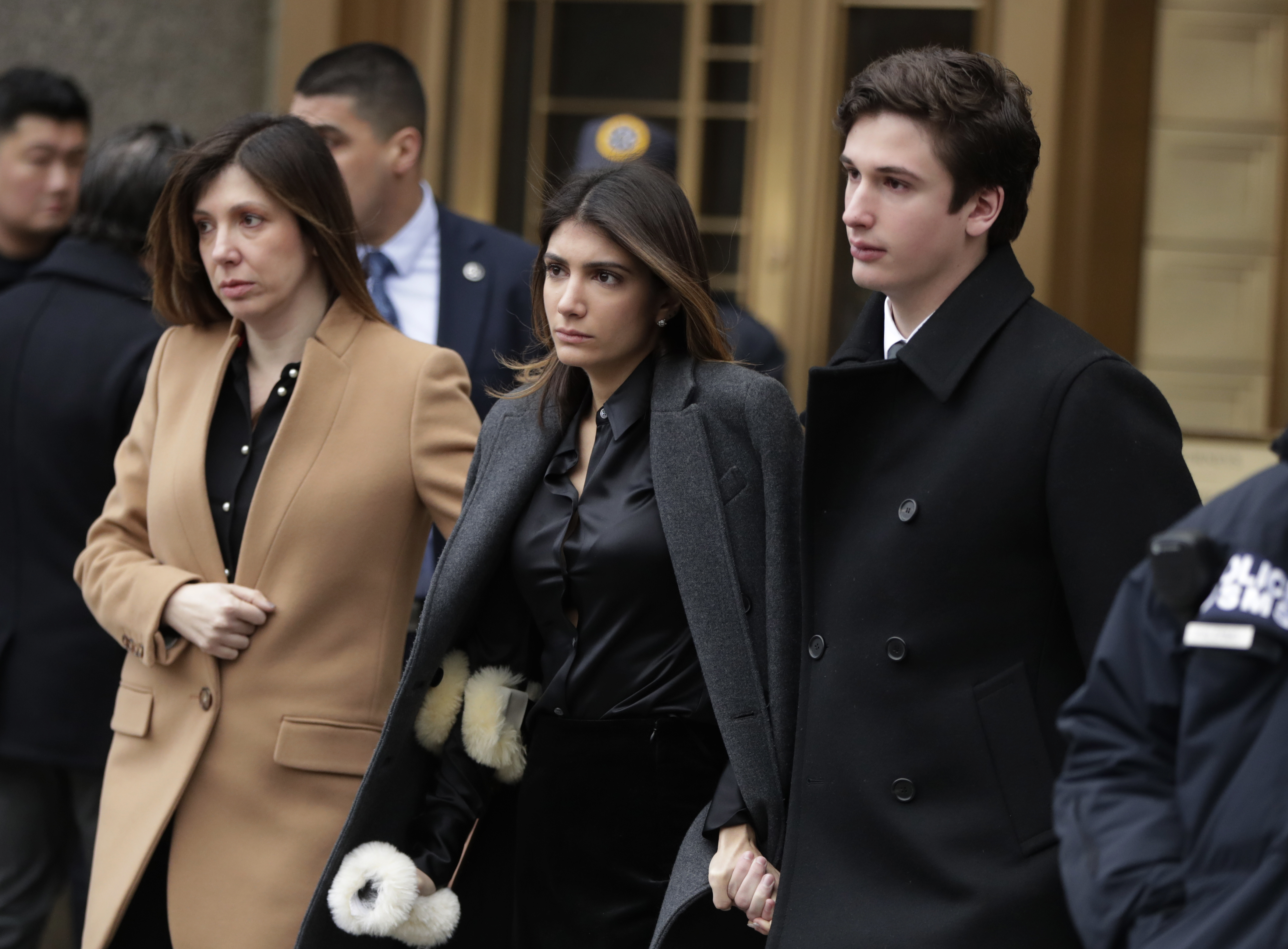 Michael Cohen’s wife, Laura Shusterman, left, exited federal court with the couple’s children, Samantha and Jake, in New York on Wednesday.