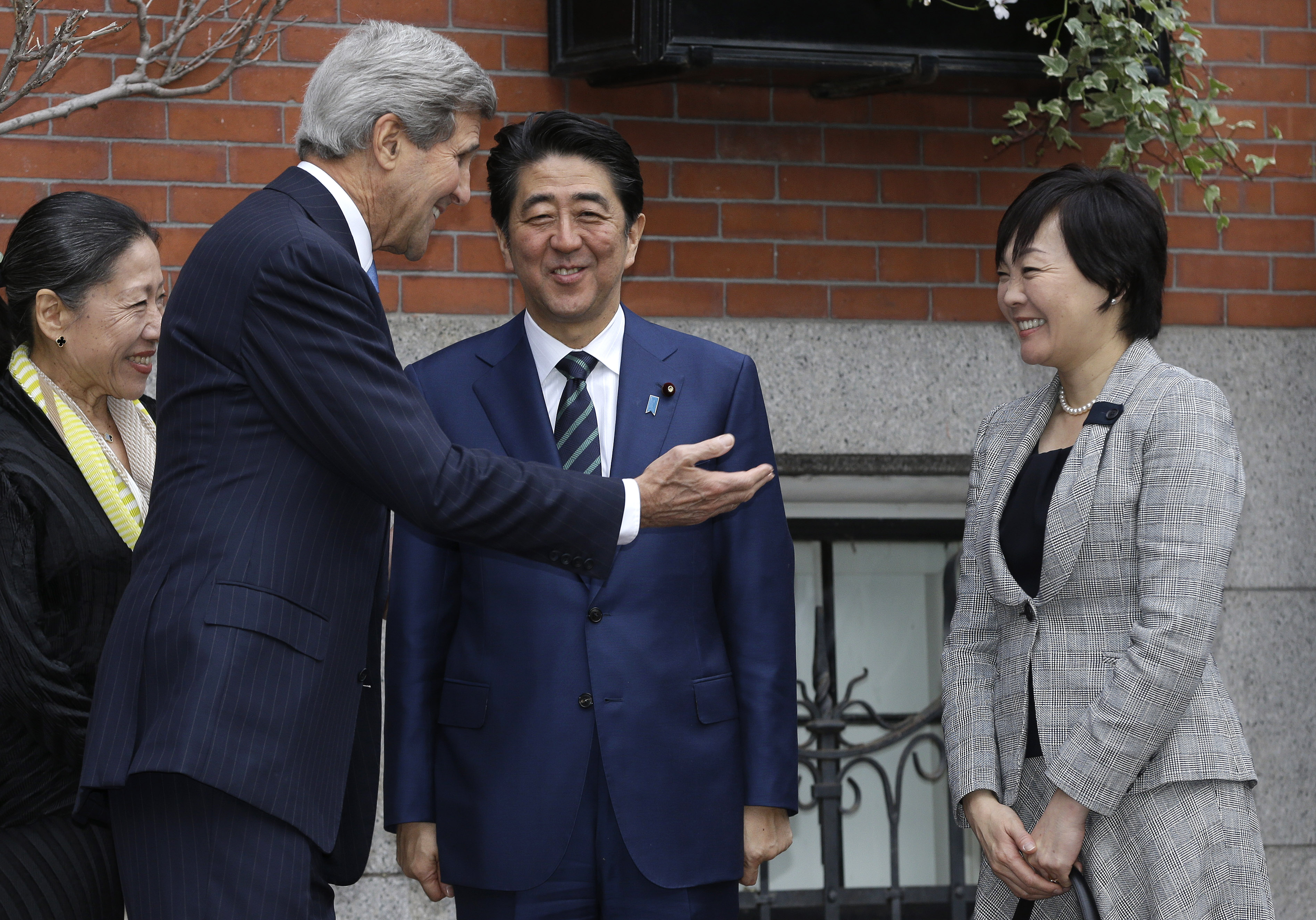 Secretary of State John Kerry greeted Japanese Prime Minister Shinzo Abe (center) and his wife Akie Abe (right) in front of Kerry’s Beacon Hill home on Sunday.