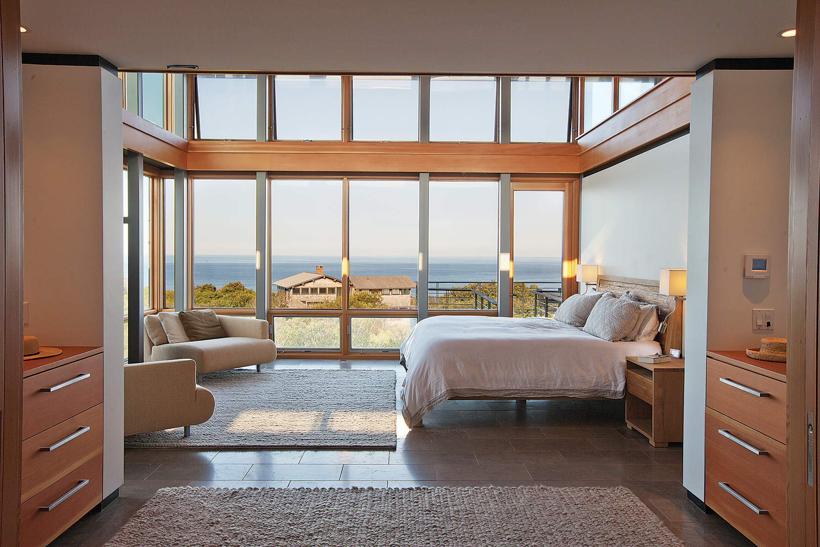 Clerestory windows and limestone floors continue in the master bedroom.