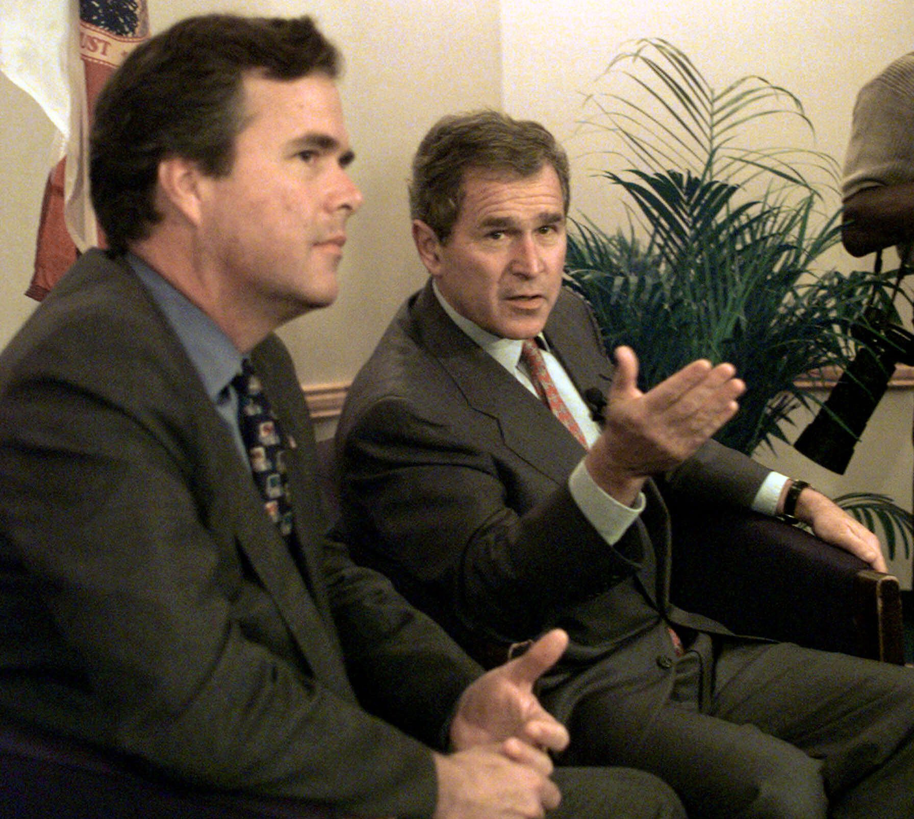Then-Texas Governor George W. Bush speaks at a news conference in 1998.