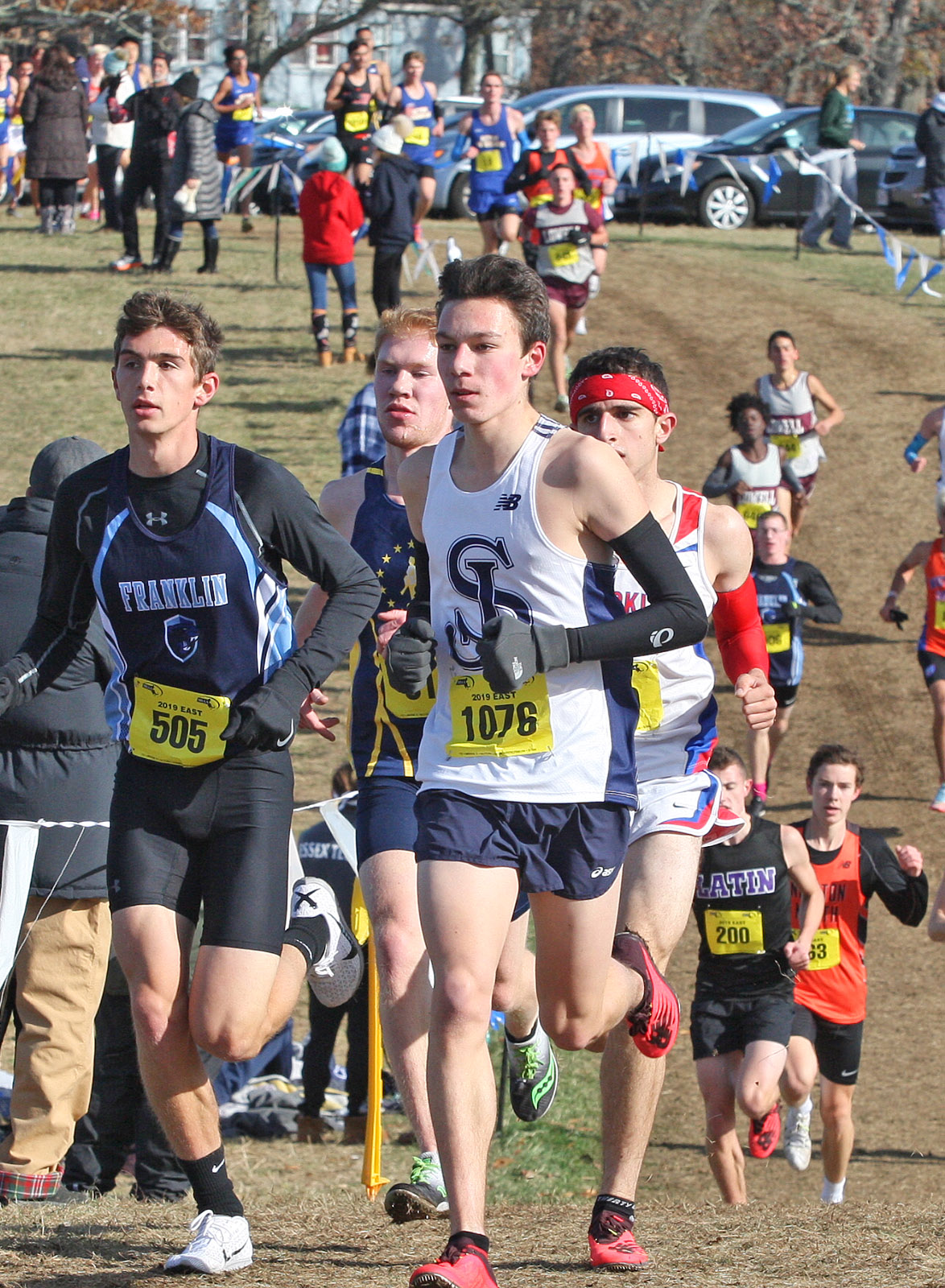 St. John’s Prep senior Steven Jackson (Bib no. 1076) leads eventual D1 winner Tyler Brogan (505) of Franklin.