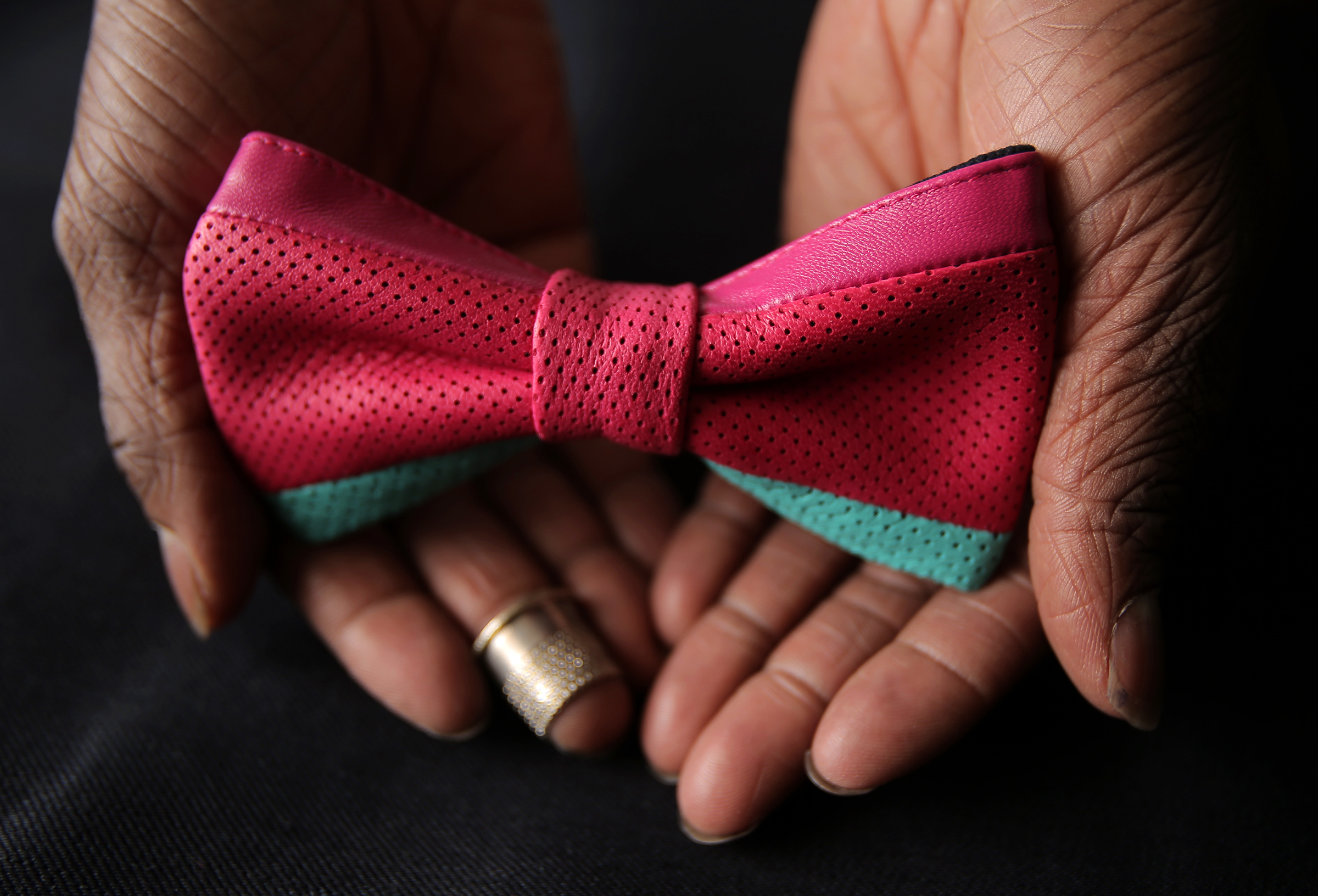 Christopher Chaun Bennett makes high-end bow ties in the bedroom of his apartment.