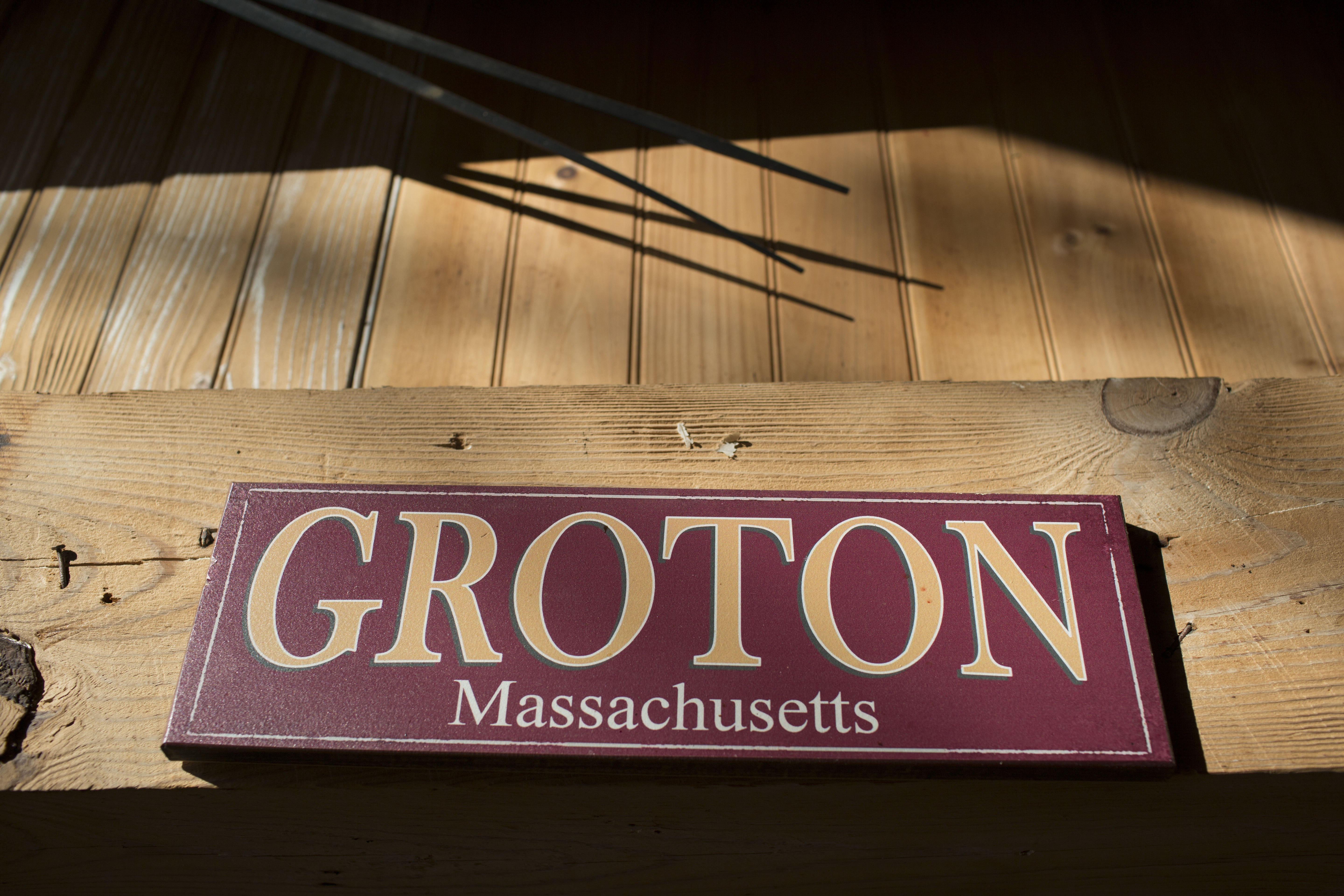 A sign inside an old barn.