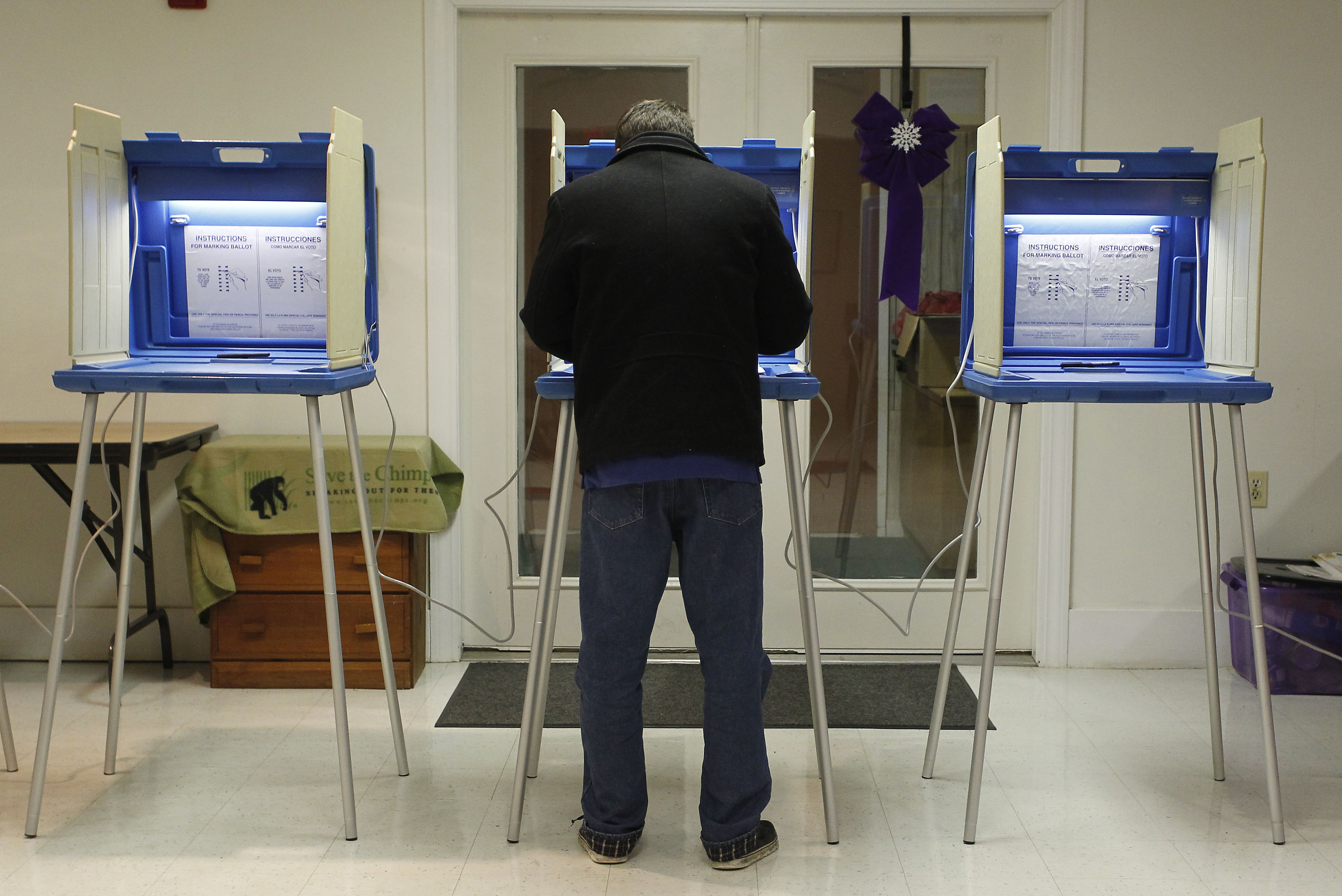 Cameron Bourassa marked his ballot inside a polling station Saturday during a recall election of four of Exeter, R.I.’s five City Council members.