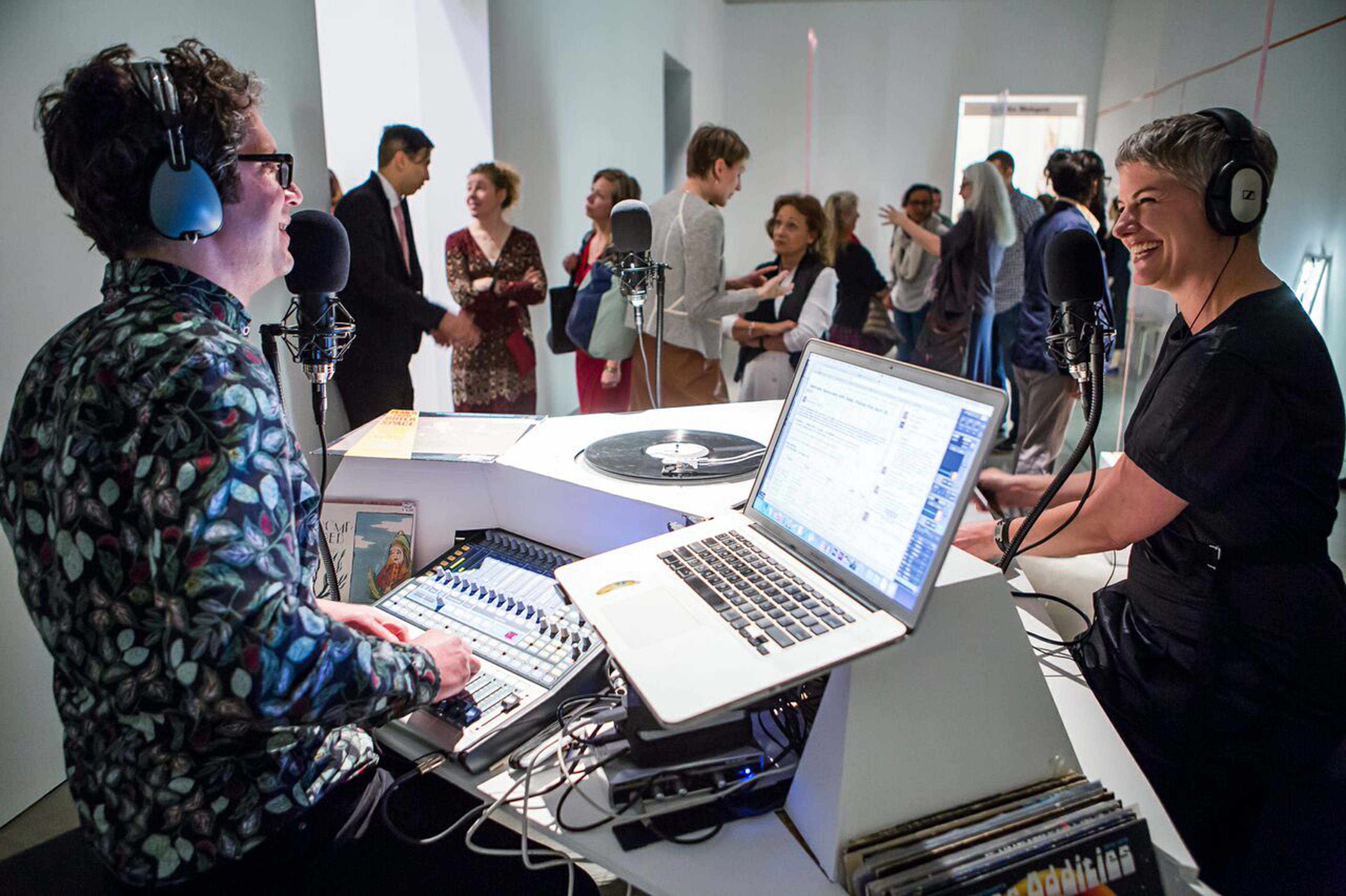 DJ Jesse Kaminsky with viewers in Ricardo De Lima’s gallery at the ICA.