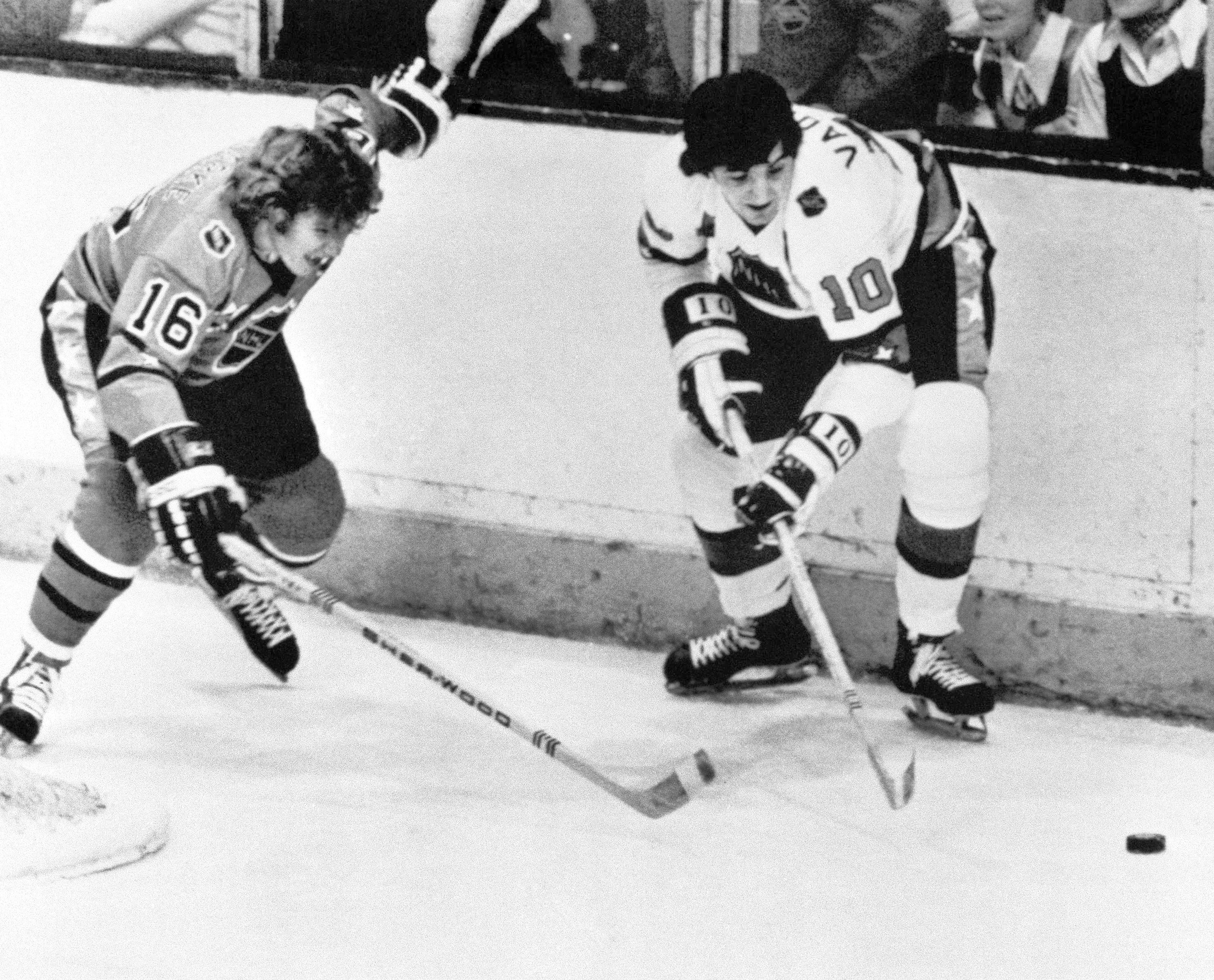 Carol Vadnais (right) spars with Bobby Clarke during the 1975 NHL All-Star Game.