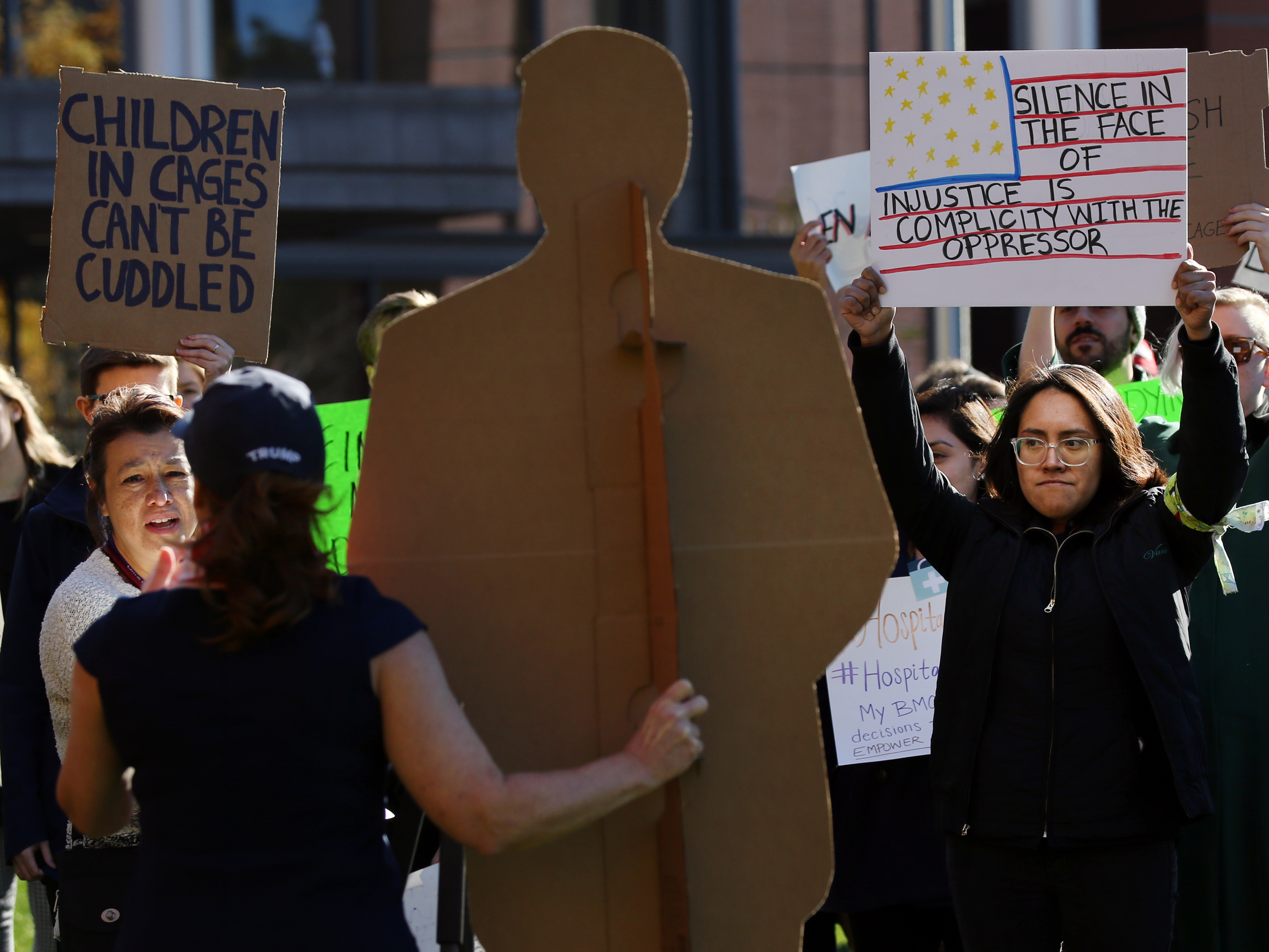 Dianna Ploss, the founder of MA 4 Trump, brought a cutout of President Trump to a protest being held by Boston Medical Center employees outside the Moakley Building during Melania Trump’s visit to the hospital.