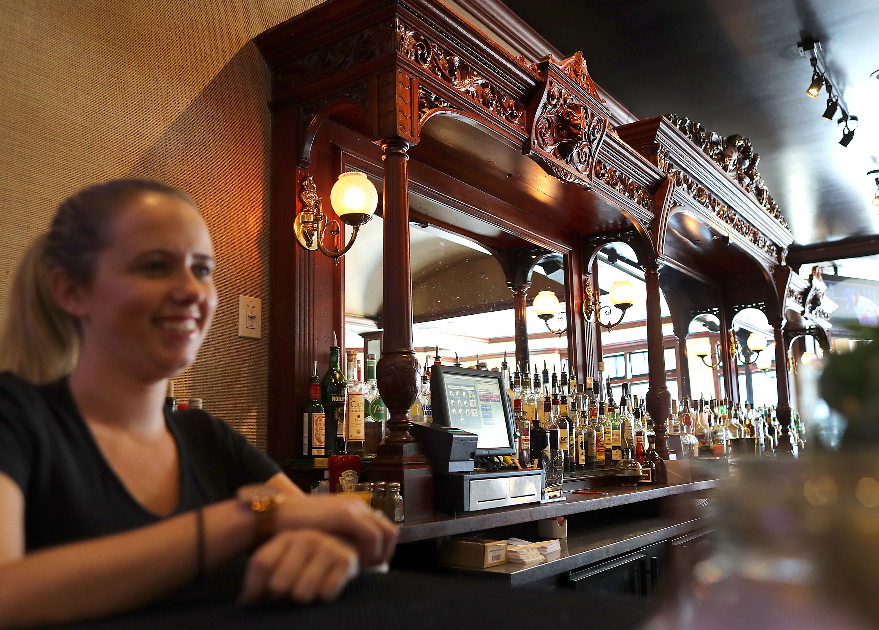 Server Maureen Walsh waited at the bar which is the oldest hand carved bar in America.