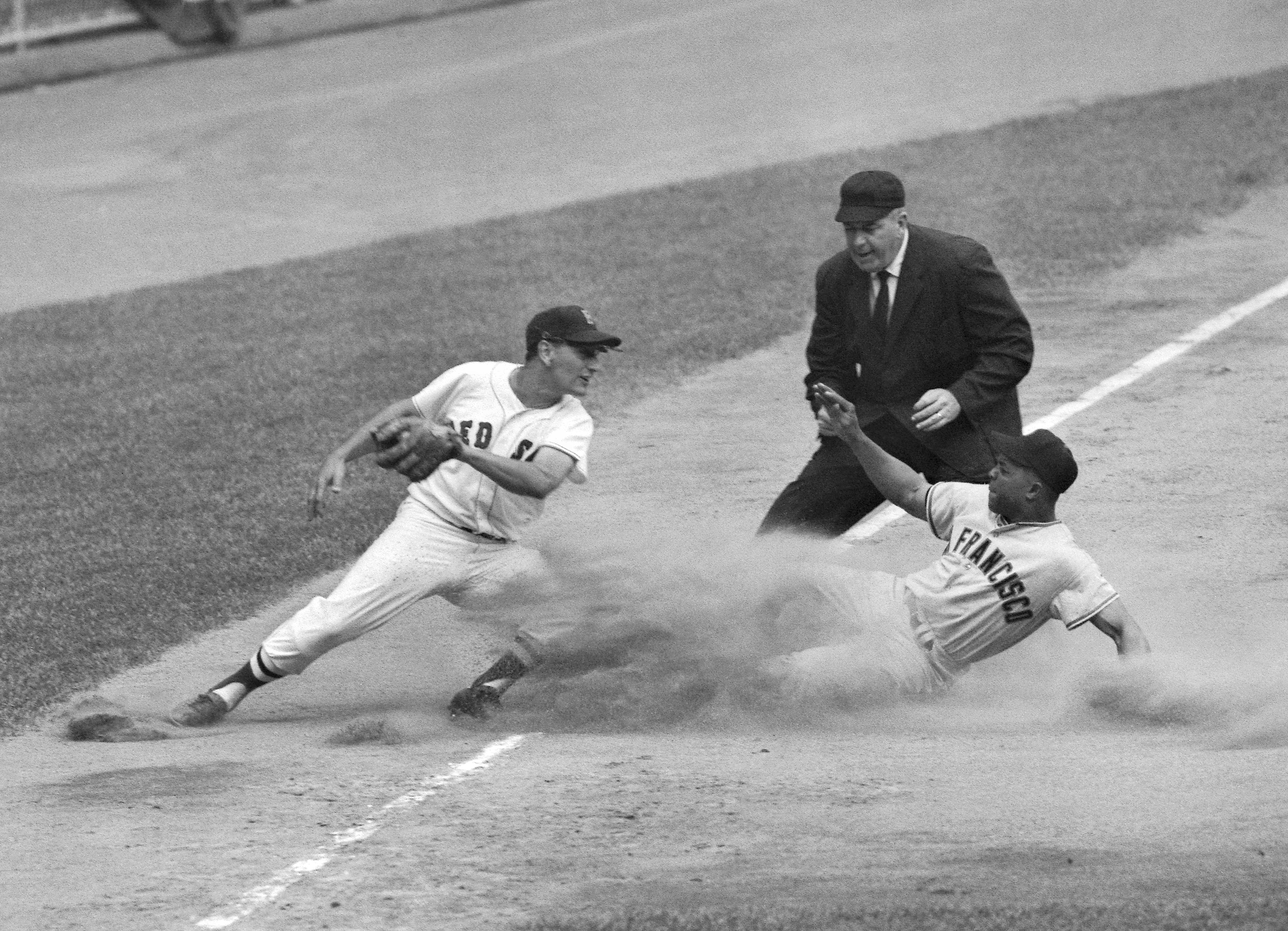 Willie Mays slid into third, just under a tag from Frank Malzone, in the 1960 All-Star Game.
