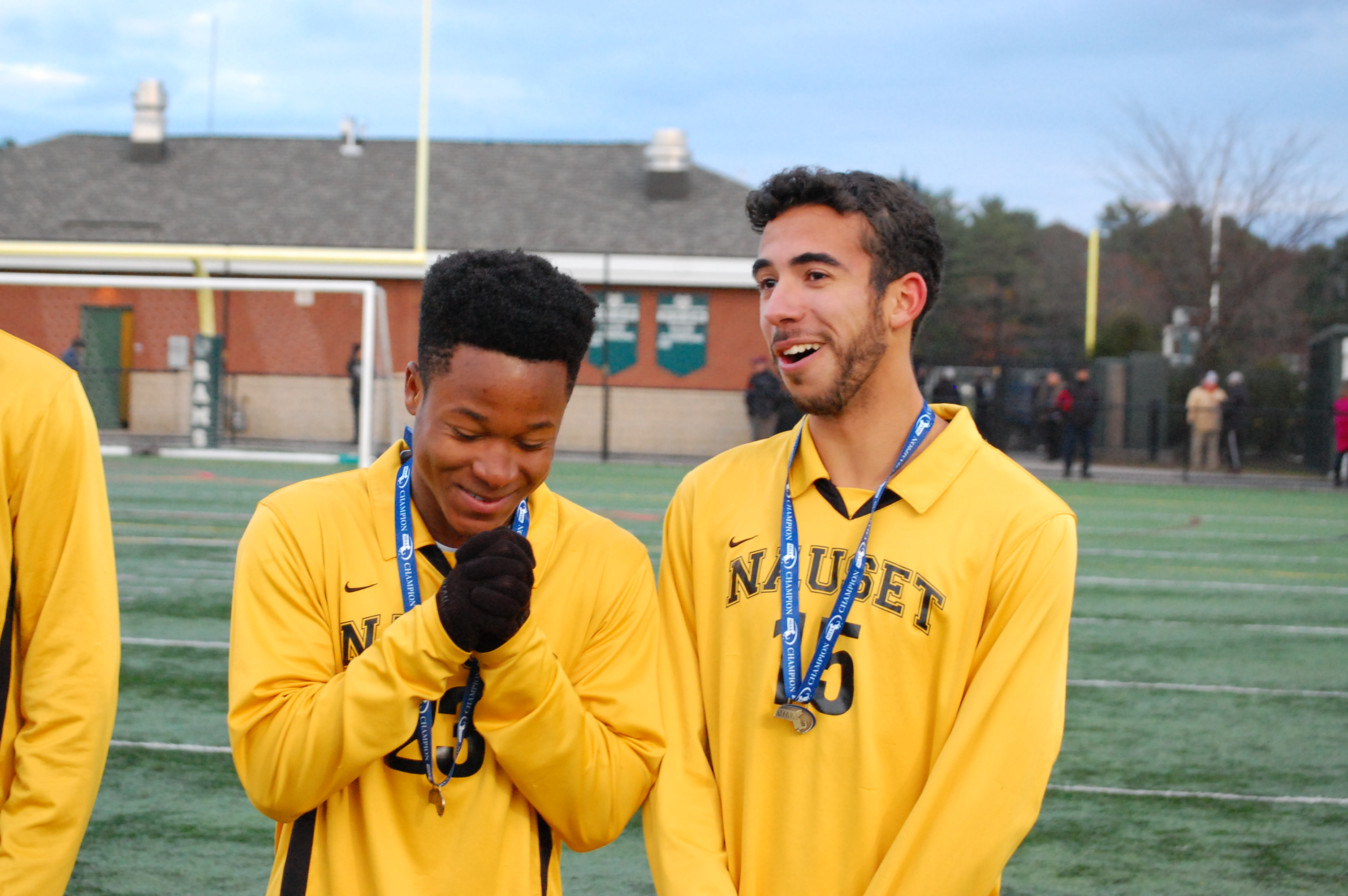 “I don’t even know how to react,” said Nauset’s Shavar Champagnie (left) after he and Joshua Santos (15) received their Division 2 championship medals at Marshfield High.