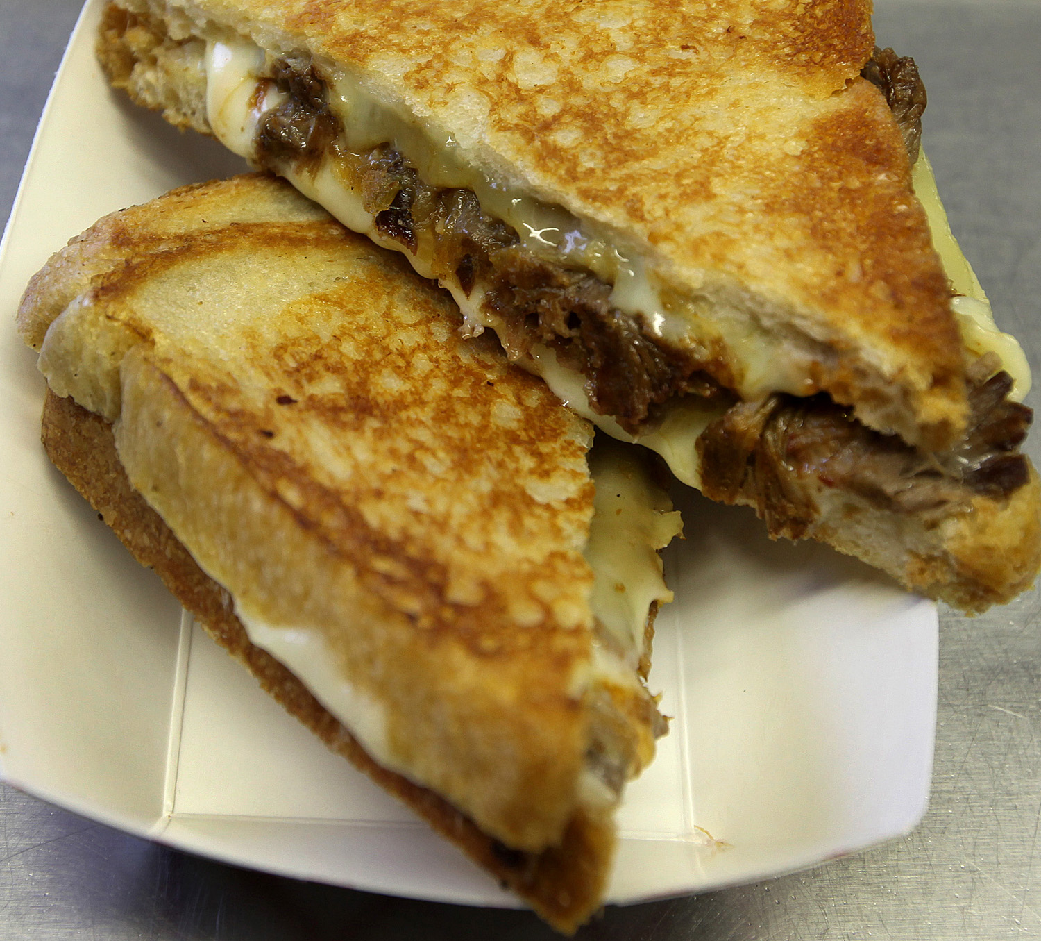The "Mighty Rib" contains Fontina, Braised Short Rib and Caramelized Onions.