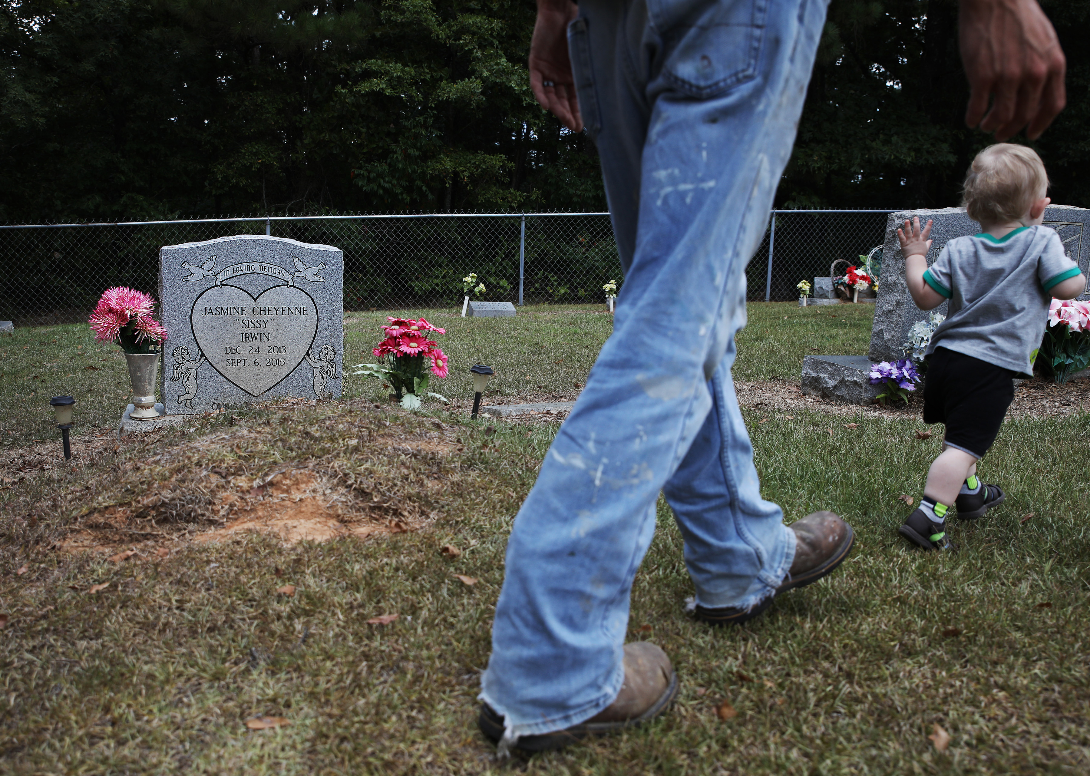 Dylan Mann chased after his 14-month-old stepson Jason while they visited the grave of Dylan's niece, Jasmine Irwin, for the first time since Jasmine's death.