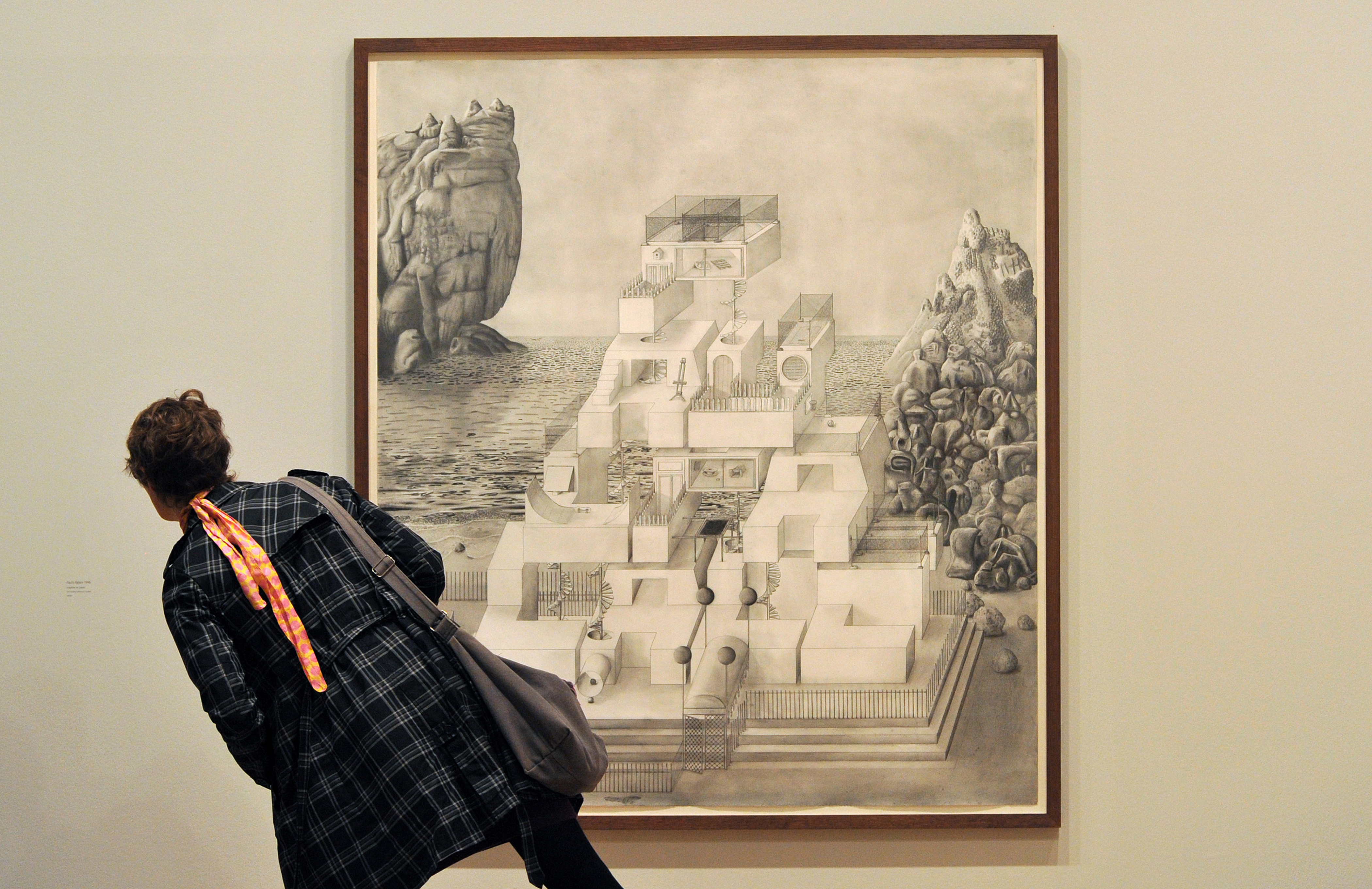 A visitor reads the description of “Paul’s Palace” by Turner nominee Paul Noble at the Tate Britain.
