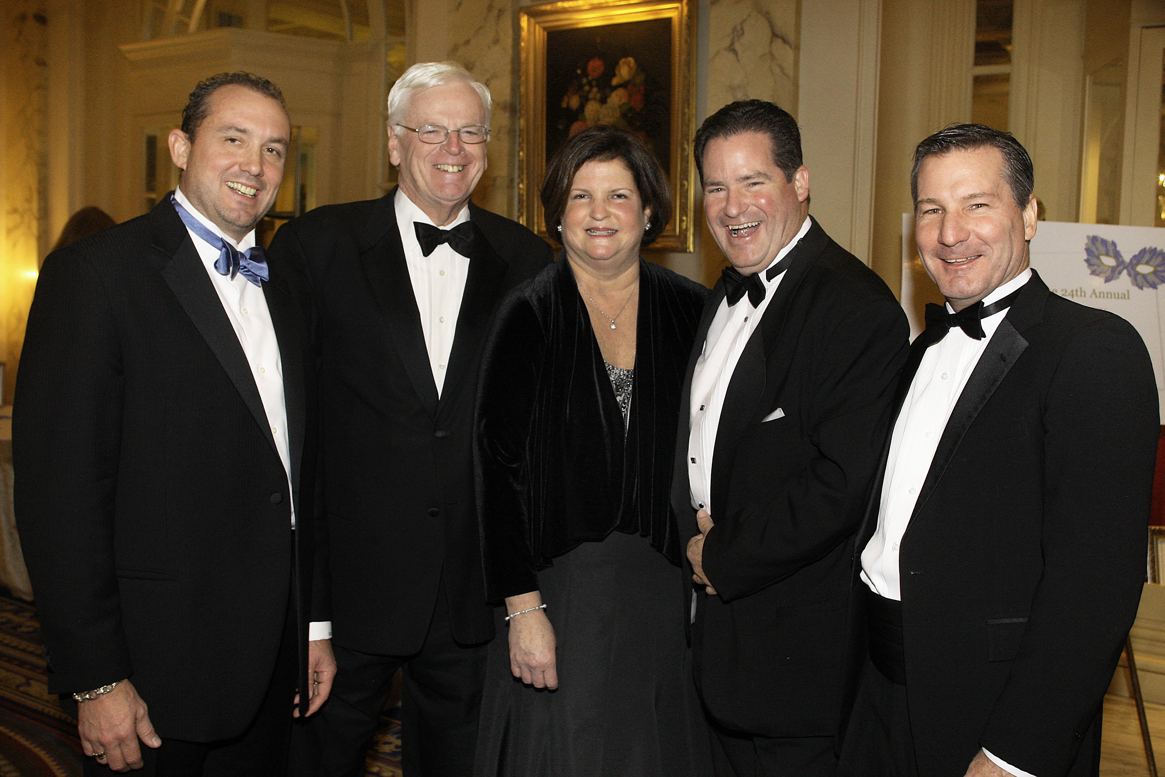 At the Boys and Girls Club of Dorchester Grand Carnivale Gala, held at the Fairmont Copley Hotel, Dan Flynn (second from right) posed with officials from the organization, including Lee Michael Kennedy (left), who is CEO of a construction company Flynn defrauded.