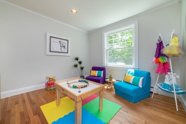 Staging experts turned the crowded family room of the empty-nester sellers into a bright playroom (above).