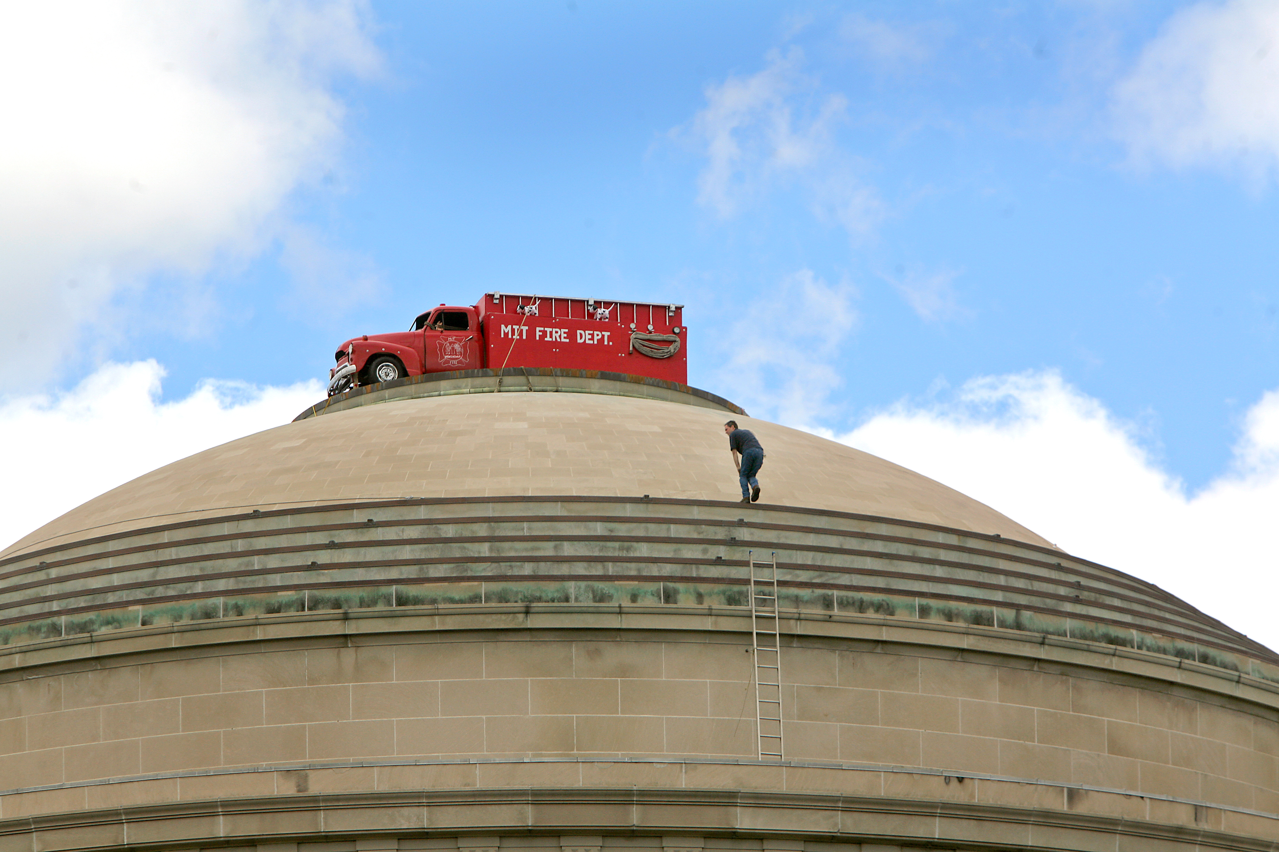 The top of the MIT dome was decorated by what appeared to be a red MIT fire truck in September 2006.