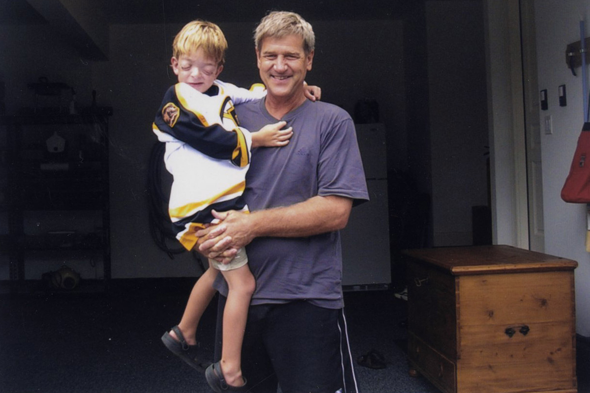 Bobby Orr spends some time with a new friend, 6-year-old Kevin Keyes Jr., who stopped by for lunch, as well as fun and games, at the legend’s home.