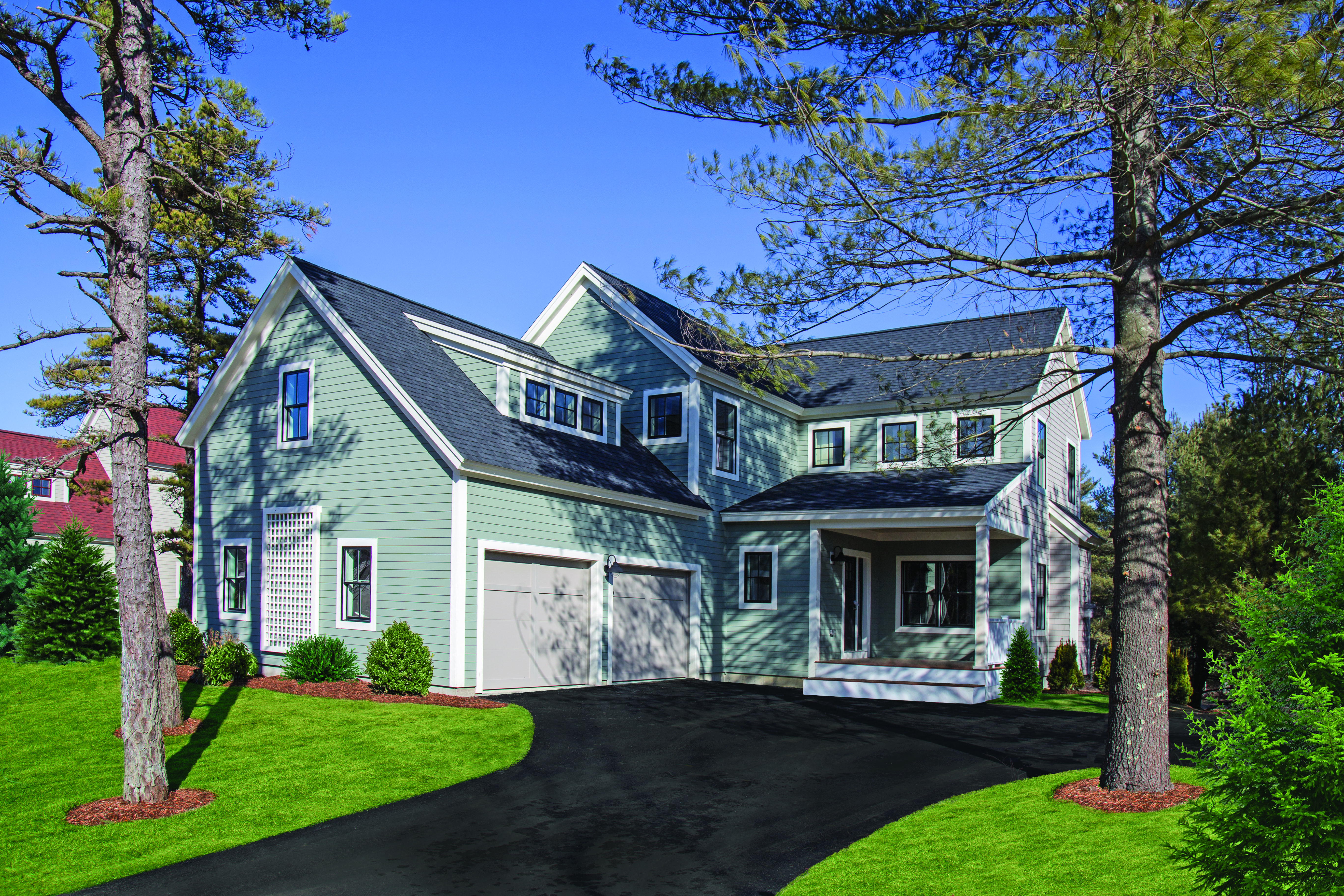 The exterior of the Cedar model at Redbrook, a new community on the southwestern edge of Plymouth that will have a town green, retail and office space, a cafe, and a YMCA.