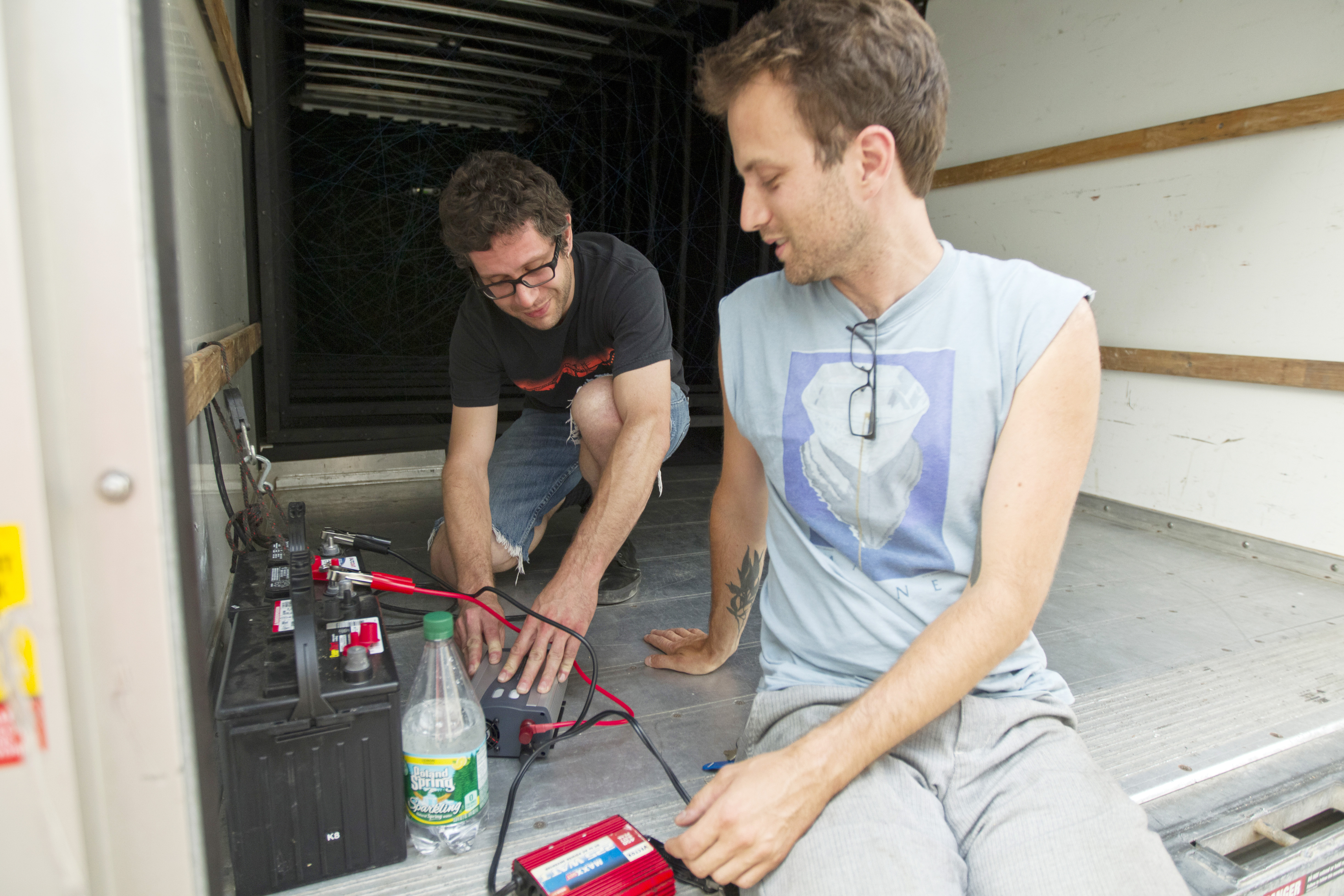 Artist Jesse Kaminsky (left) and White Walls founder Ethan Kermaier at work in the truck.