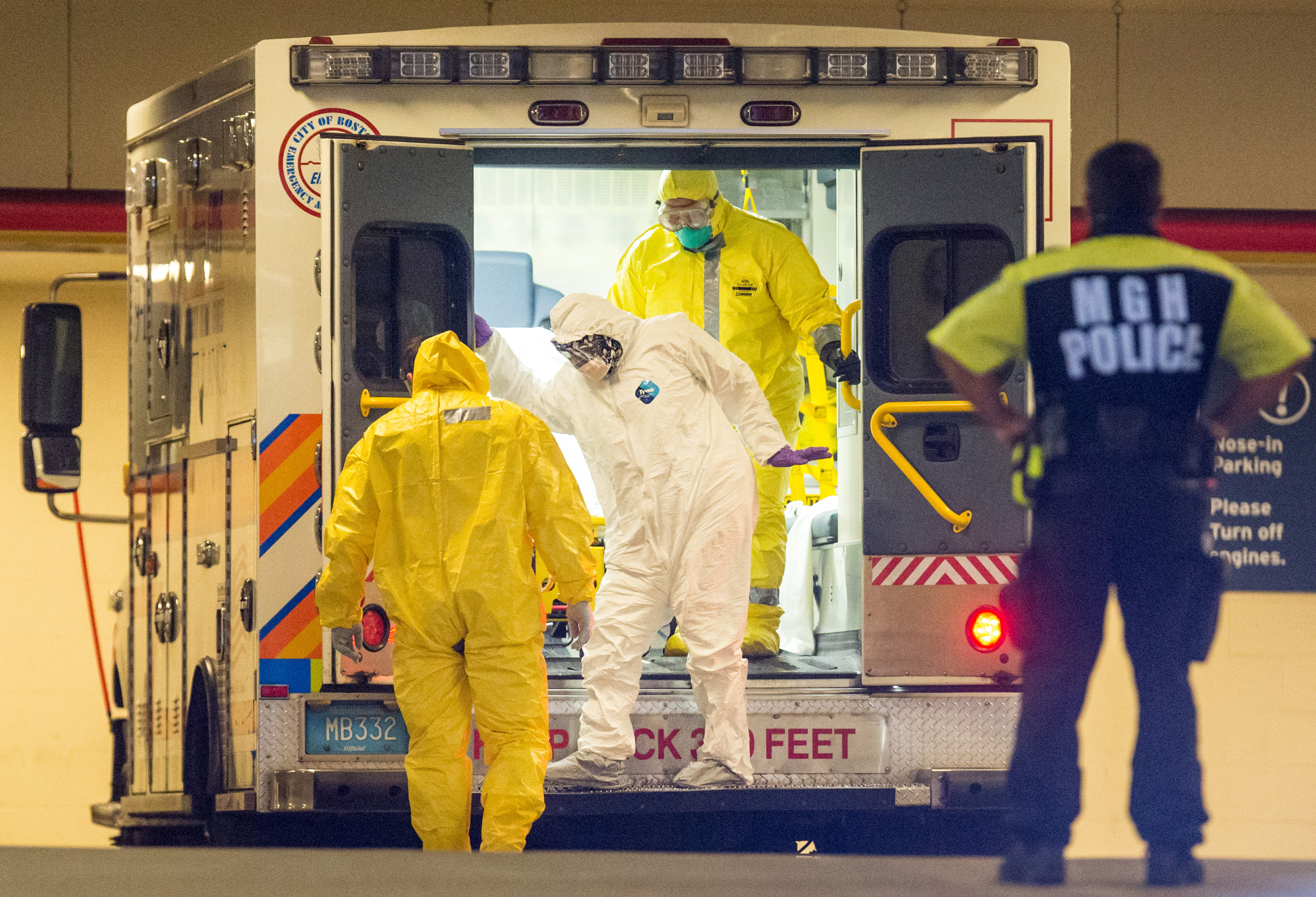Patients in white hazmat suits arrived at Massachusetts General Hospital. EMS workers wore yellow.