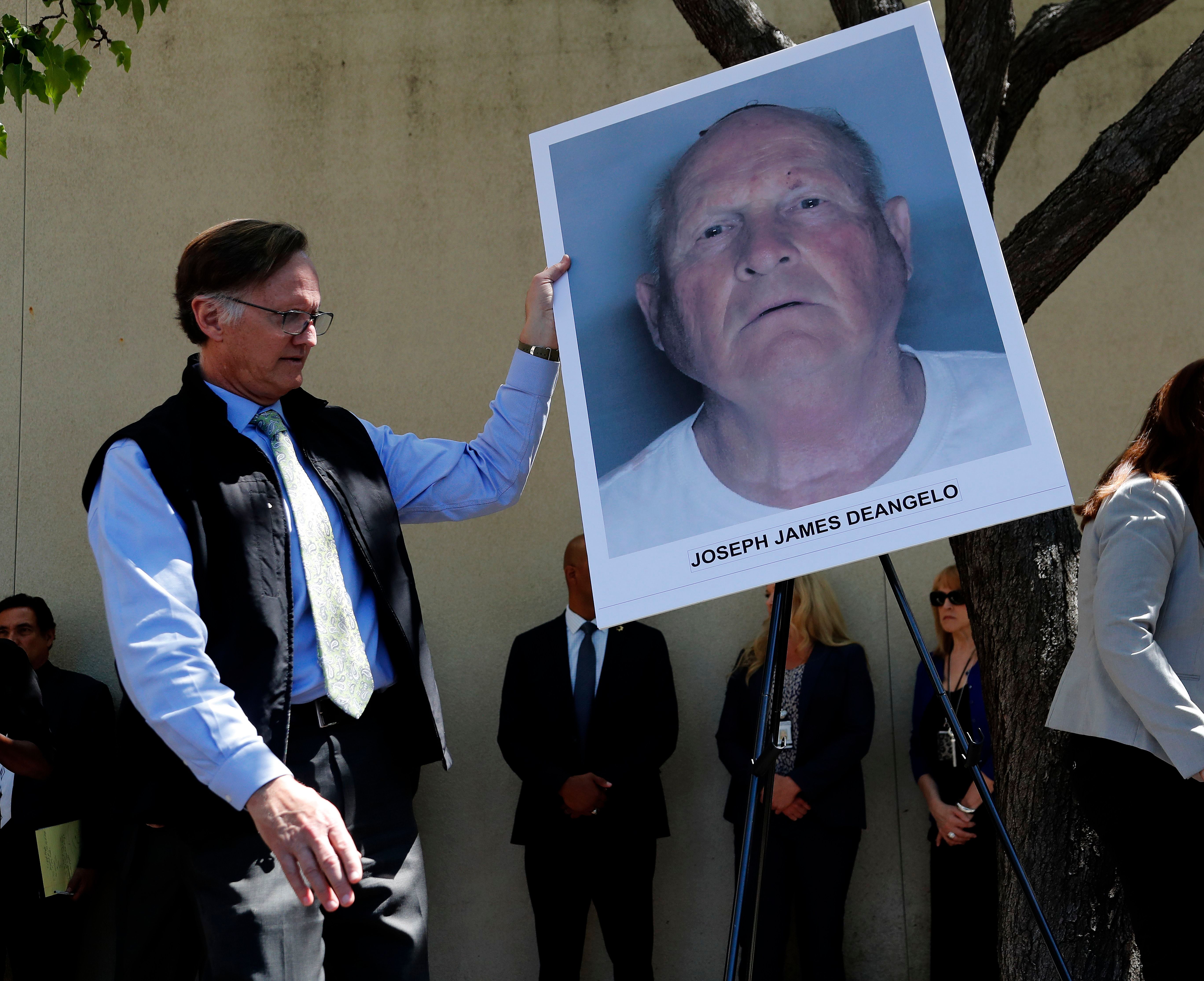 An official displayed a mug shot of Joseph James DeAngelo, suspected of being the “Golden State Killer.”