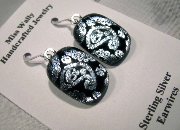 13madeinne - ***WARNING: LO RES, do not use for more than 1.5 columns *** - There's someone on your gift list who could really rock a pair of skull-and-paisley earrings from Miss Wally of Connecticut. (handout)