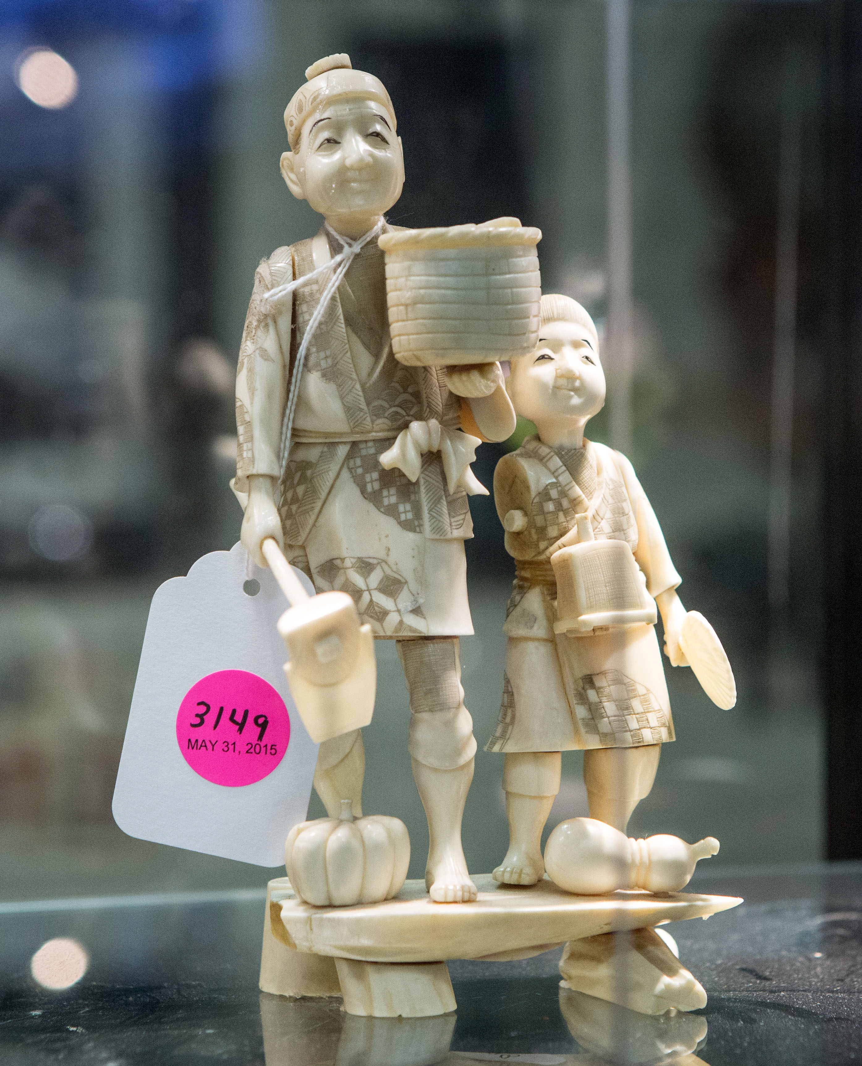 Ivory figures were described as carved from wood in a recent Kaminski Auctions catalog.