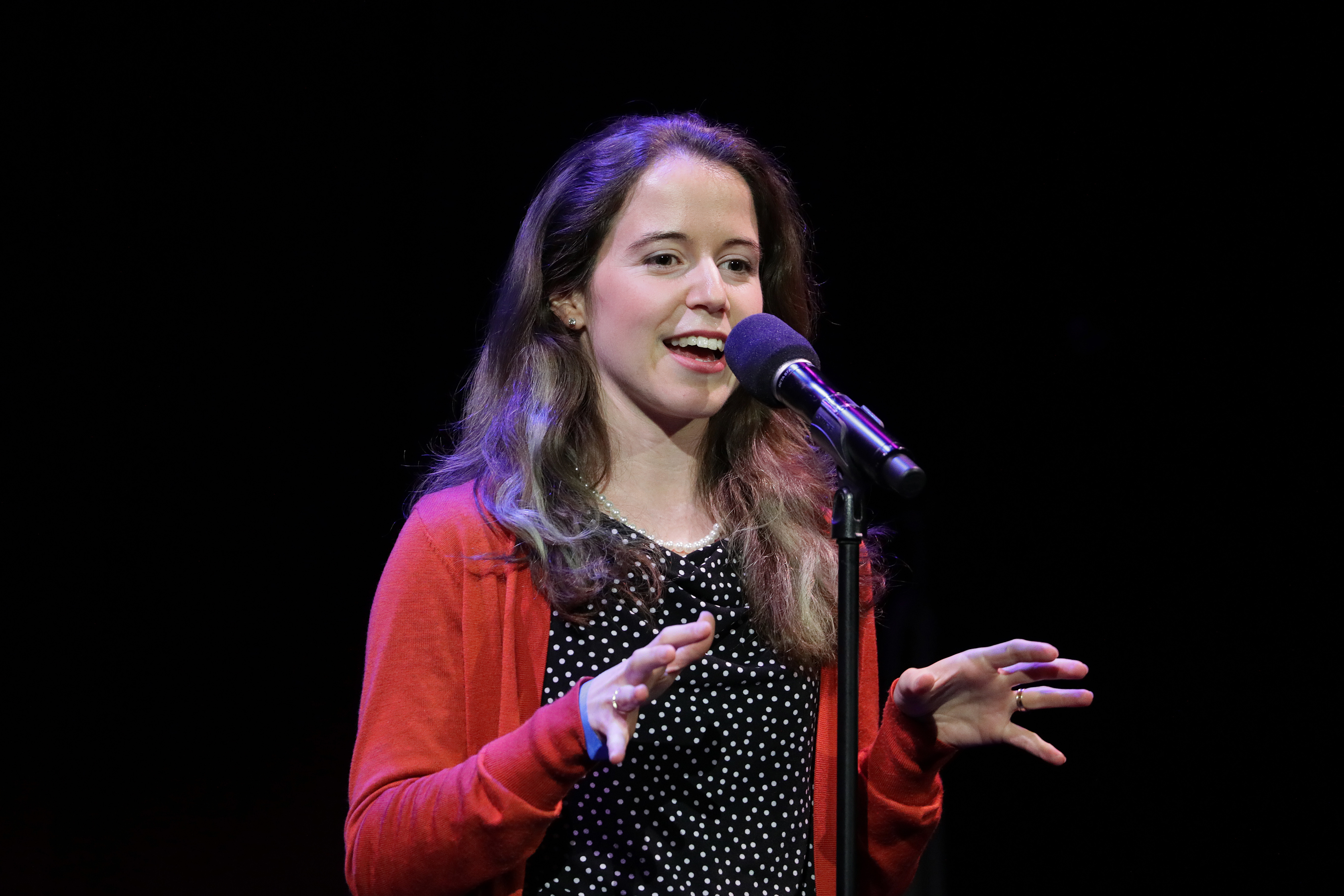 Cherie Ramirez onstage at “Story Collider,” a science-based story night at Oberon.