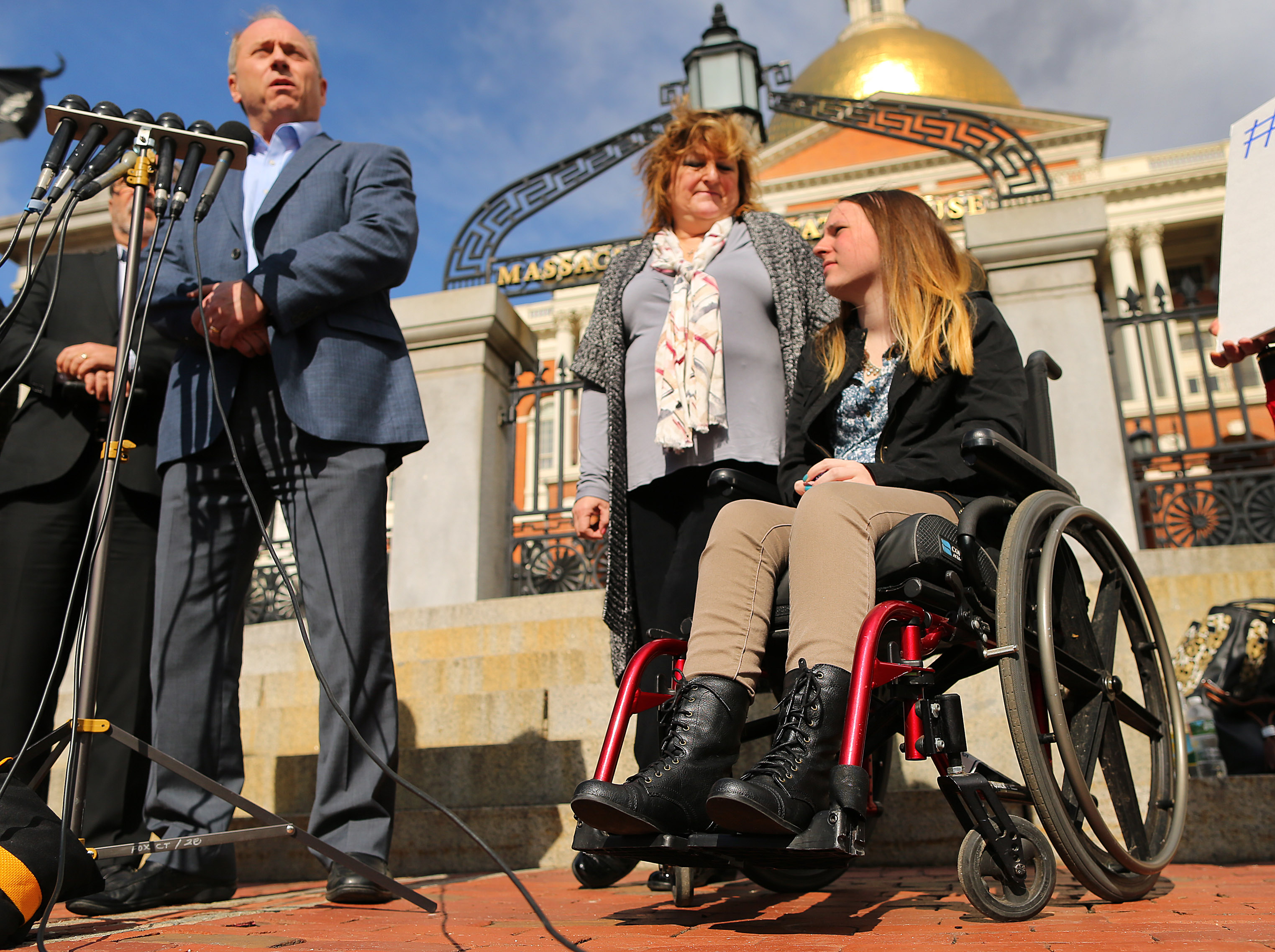 Justina Pelletier and her parents, Linda and Lou Pelletier, spoke to reporters outside the State House. The family’s lawsuit accuses Children’s Hospital care providers of negligence