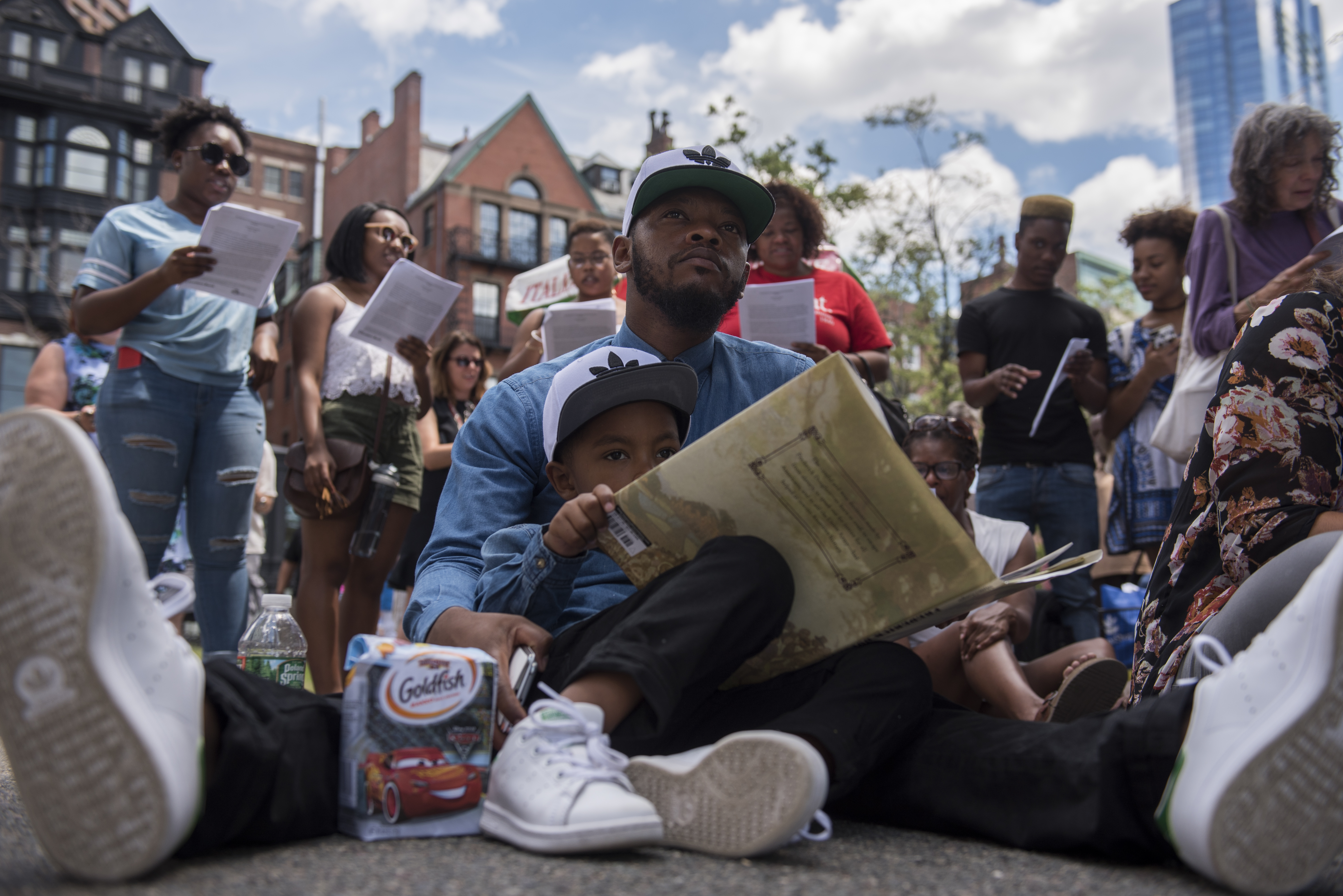 James Mackey and his son Evan listened to a reading of Frederick Douglass’s “The Meaning of the Fourth of July for the Negro.”