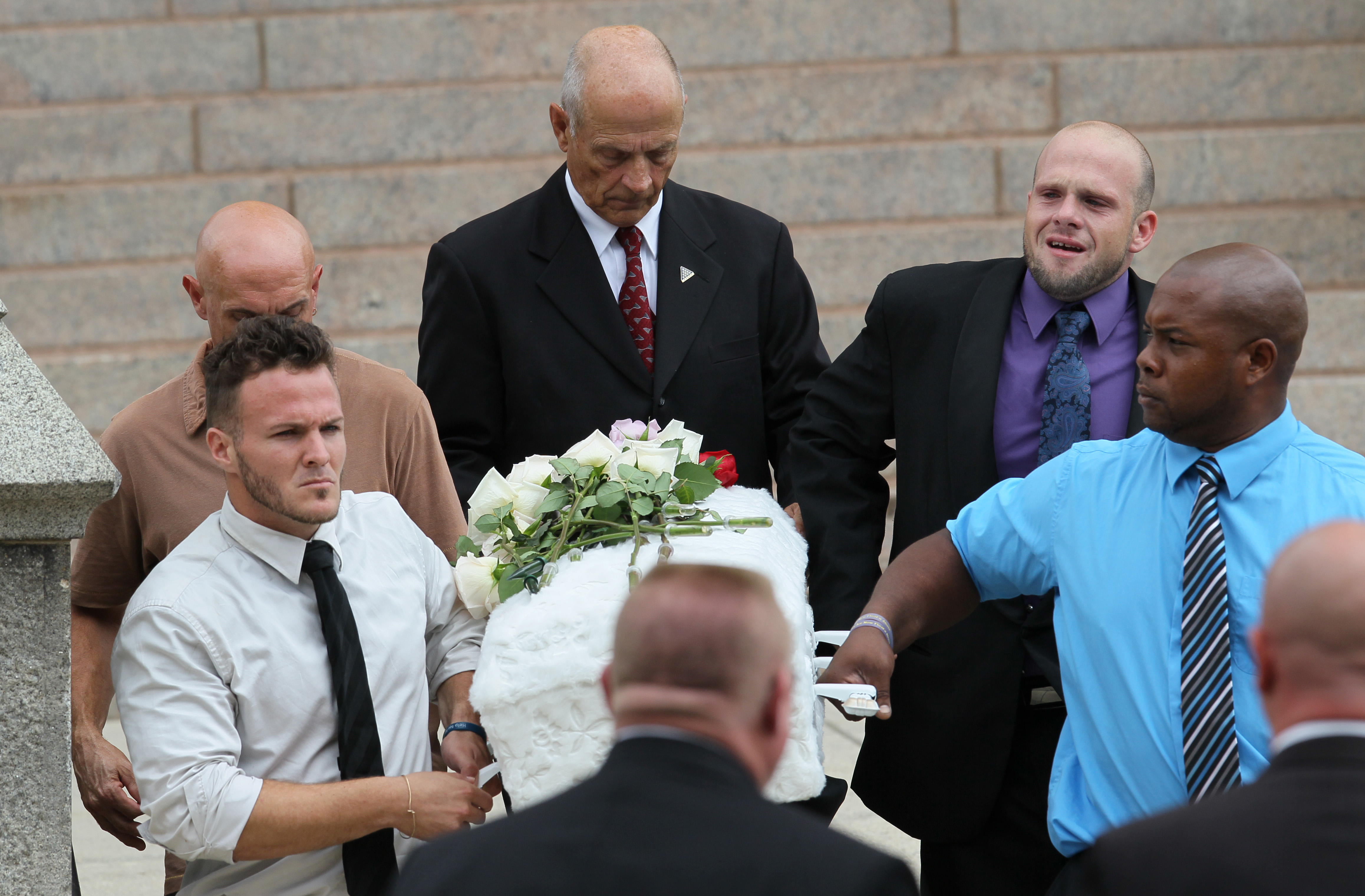 Pallbearers of Avalena Conway-Coxon included her father, Ronald Green Jr. (top right).