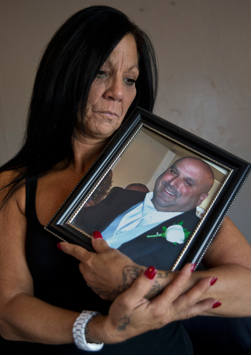 Cheryl Ferullo held a photo of her husband, Scott Ferullo, 45, who died after open gastric bypass surgery last year.