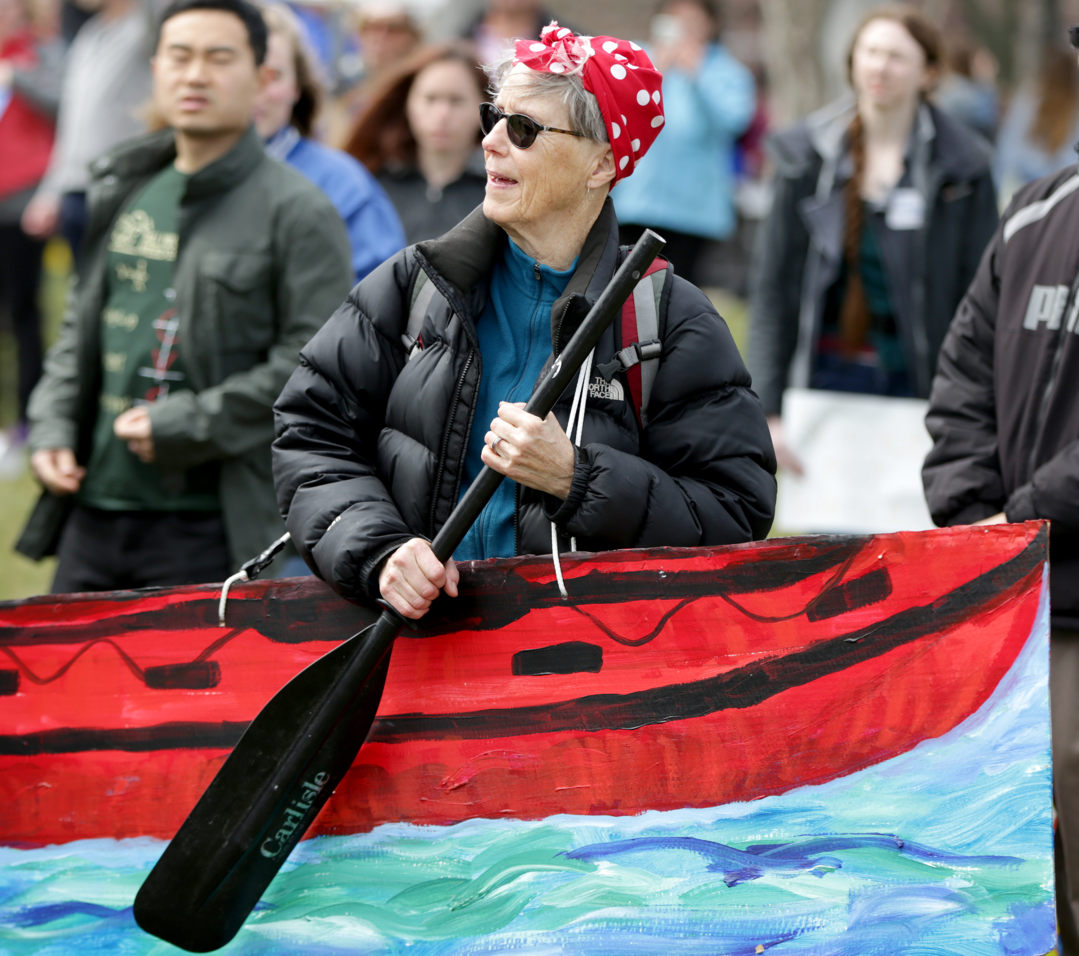 Mary Russell attended the rally with her sign made to look like a boat.